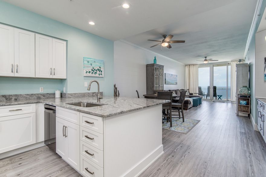 This completely renovated GORGEOUS Penthouse unit is sure to impress with no expense spared in the renovation process! Enjoy security with gated property access as well as limited access to the Penthouse floor. The kitchen has been completely remodeled with new shaker style soft-close cabinetry, new black stainless steel Whirlpool appliances, beautiful Dolomite countertops with a breakfast bar and additional storage underneath as well as a pantry. Just off the dining area is a wet bar which has also been remodeled with new cabinetry, Dolomite countertops with a wine fridge. The new luxury vinyl plank flooring flows throughout the entire unit giving for a nice cohesive feel. The spacious master suite offers Gulf views right from your bed with floor-to-ceiling windows and balcony access. You