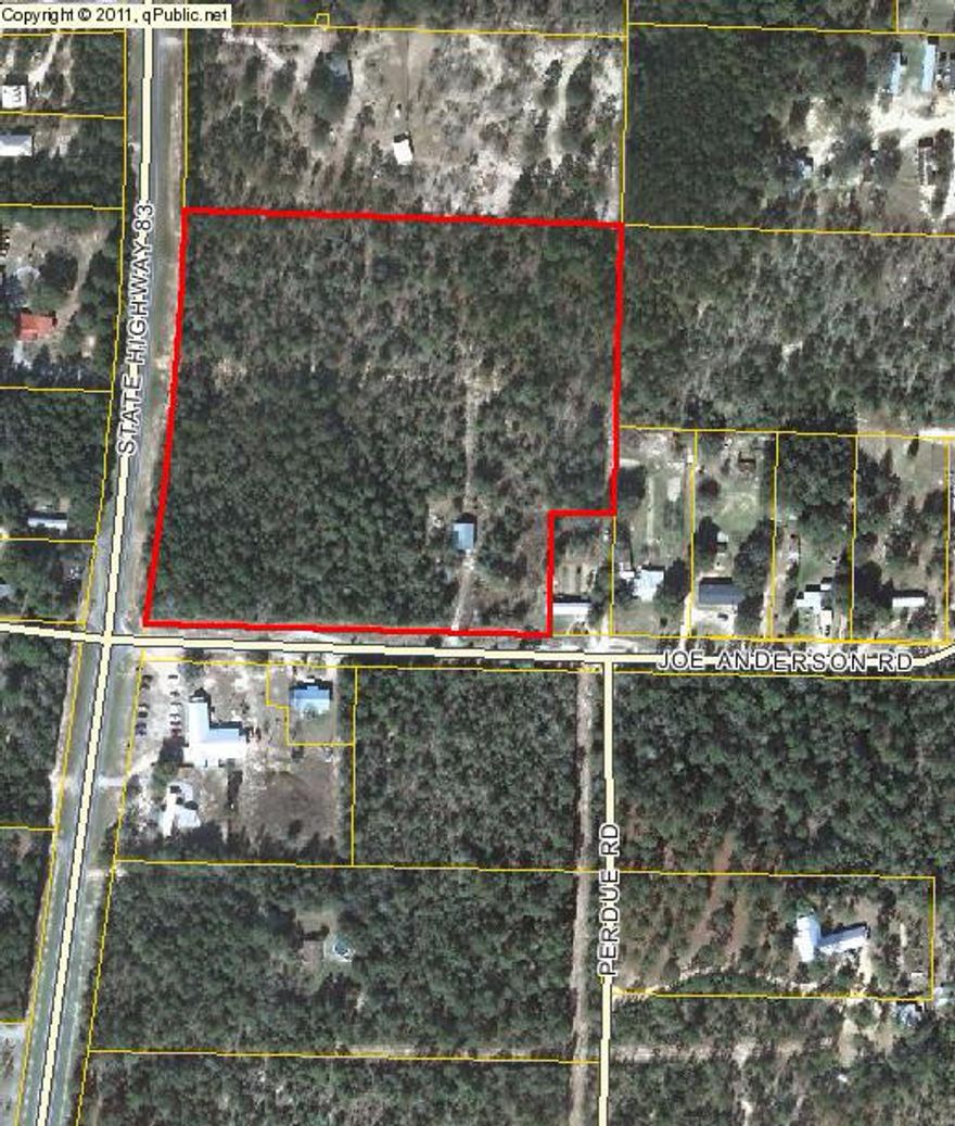 GREAT 10.8 ACRE PARCEL WITH SHOP! Don't miss out on this wooded parcel with frontage on BOTH State Road 83 N AND Joe Anderson Road! A very nice 1200 sq. ft. barn/workshop with concrete floor and metal roof is also included with this property. You can build your dream home or bring in a mobile home. Bring the horses -- there are so many possibilities! Seller has a recent survey showing the property to be 10.8 acres. Buyer to perform all due diligence to determine if property is suitable for intended use. All dimensions to be verified by buyer at buyer's expense.