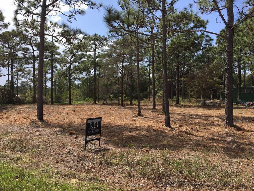 JUST LOWERED $100,000 in price and is an amazing value for this land. The location to Sacred Heart for the price has no comparison!!!!!!!!!!!!!Property in this area is escalating in price each month and becoming increasinglymore difficuly to find.Owners of the property with mobile home directly behind this parcel have been given notice that their property must to be cleared of all trash on their property extending to ours.