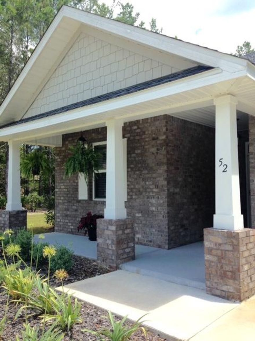 Back on the market-financing fell through! Let this be your opportunity for a great buy! CDD IS PAID! This 3/2 like new home offers many upgrades. Large lot that backs up to the nature preserve providing the utmost in privacy! Welcoming front and back porches for enjoying the outdoors. Interior features: New glass storm door, custom window blinds throughout, granite countertops in kit/baths, tile flooring in foyer, kit, dining, laundry and baths. Spacious mbdr has trey ceiling, mbath has oversized shower w/glass door, dbl vanity sinks and large walk in closet. Kitchen includes a breakfast bar and island. Upgraded appliances. Exterior features low maintenance brick w/vinyl soffits, 2 car garage,and utility sink, professionally landscaped yard w/irrigation system and well. Maintained home!!! Enjoy all the wonderful amenities Hammock Bay offers...2 pools, Clubhouse w/theater, fitness ctr, sports complex, Bayfront Park, miles of sidewalks, bitk and walking trails. Hammock Bay is in a CDD and has a .5% maintenance fee due at closing.