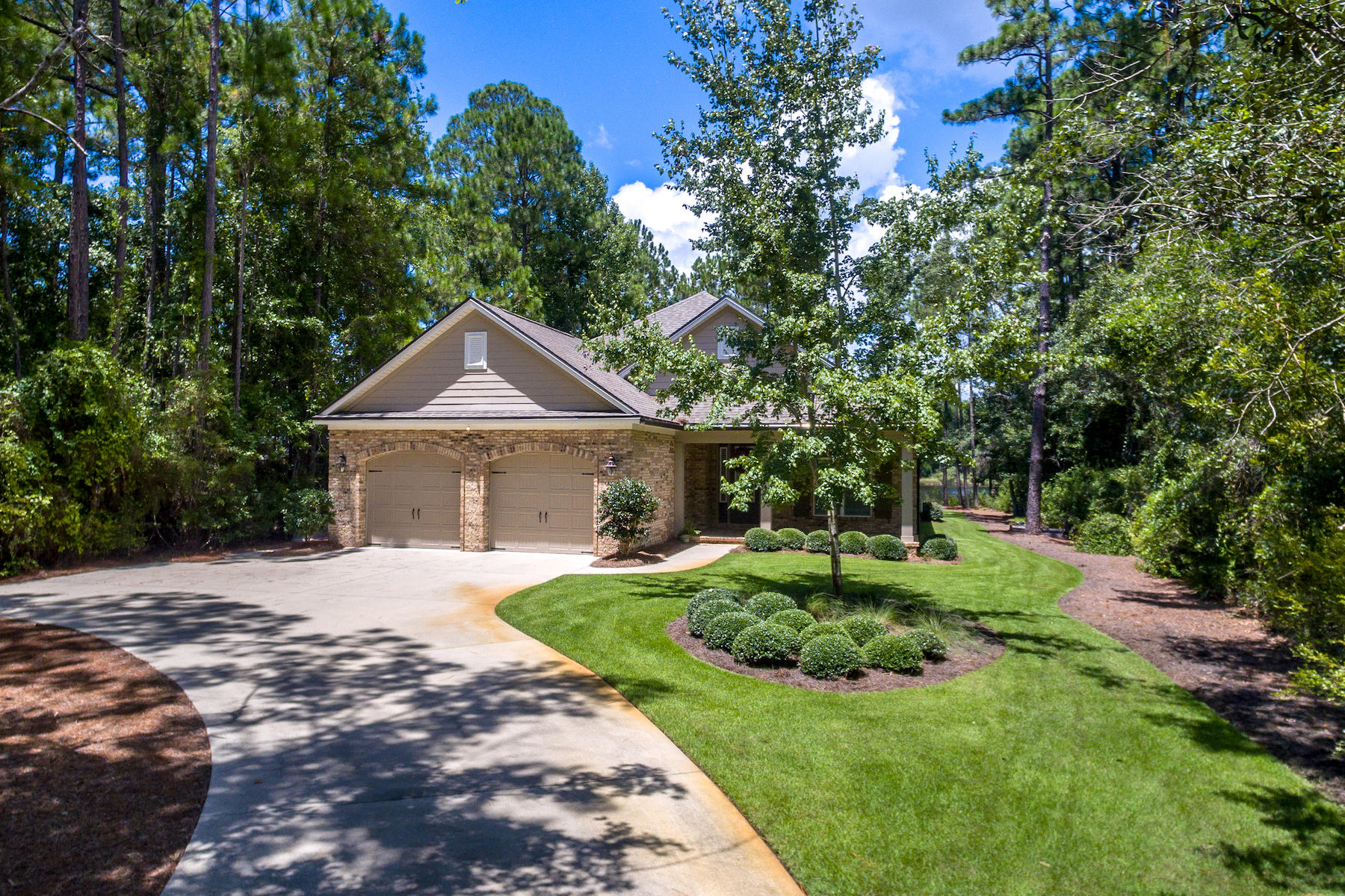 An amazing home with so much to offer! The fantastic natural setting amidst the pines on beautiful Mallet Bayou is just minutes from Choctawhatchee Bay by boat and a quick drive to South Walton County and the Beaches of 30A or Freeport via Highway 331!Built by respected contractor Randy Wise, the home shows attention to structural integrity with its brick exterior, partial hip roof, impact-resistant doors and windows, and more. The highly functional floorplan includes a large open living/dining room and kitchen, with views toward the bayou, one hallway for the master suite, another hallway for two additional bedrooms and their shared bath (with double sinks), plus a fourth bedroom and/or office and powder room off the foyer.The home's appeal is enhanced by high ceilings, travertin