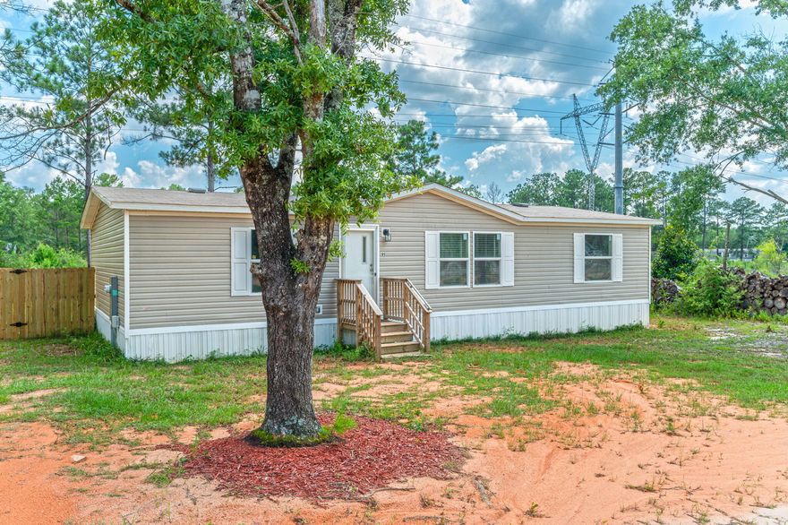 Step into tranquility with this charming 3 bed, 2 bath home nestled on a 0.23-acre lot. The inviting interior boasts a spacious kitchen and a convenient island--ideal for preparing meals and gathering with loved ones. Outside, a fenced backyard offers the perfect retreat for relaxation and outdoor entertaining. Conveniently located just a short drive from town and affordably priced, this home is perfect for a first home or investment property!