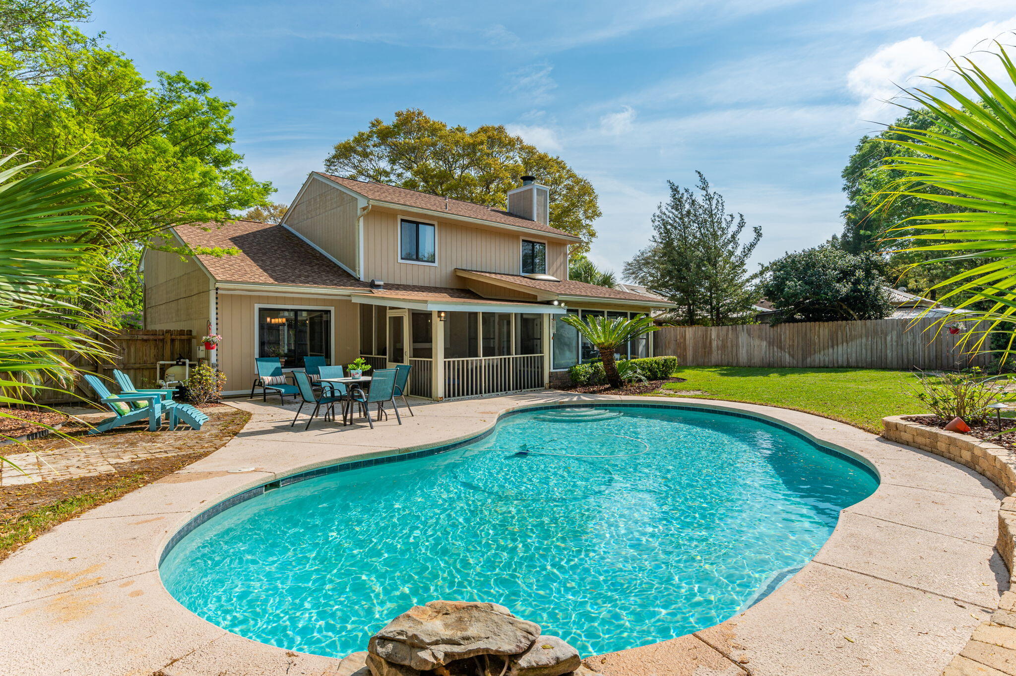 Find this updated POOL HOME perfectly located in the desirable Rockywood neighborhood of Niceville, just 1/4 mile from the Publix shopping center and 1/2 mile from the Rocky Runway Municipal Park. Soaring cathedral ceilings welcome you into the light-filled living and formal dining space that then flows seamlessly into the fully renovated kitchen with custom cabinetry, farmhouse sink, all new stainless steel appliances, and gorgeous quartz counters. Off of the kitchen, discover a cozy family room with painted brick fireplace perfect for quiet gatherings. Just beyond a pair of French doors, fall in love with the additional, flexible space provided by the heated and cooled sun room (NOT INCLUDED in the listed square footage) bathed in natural light. Continue through the sun room to the
