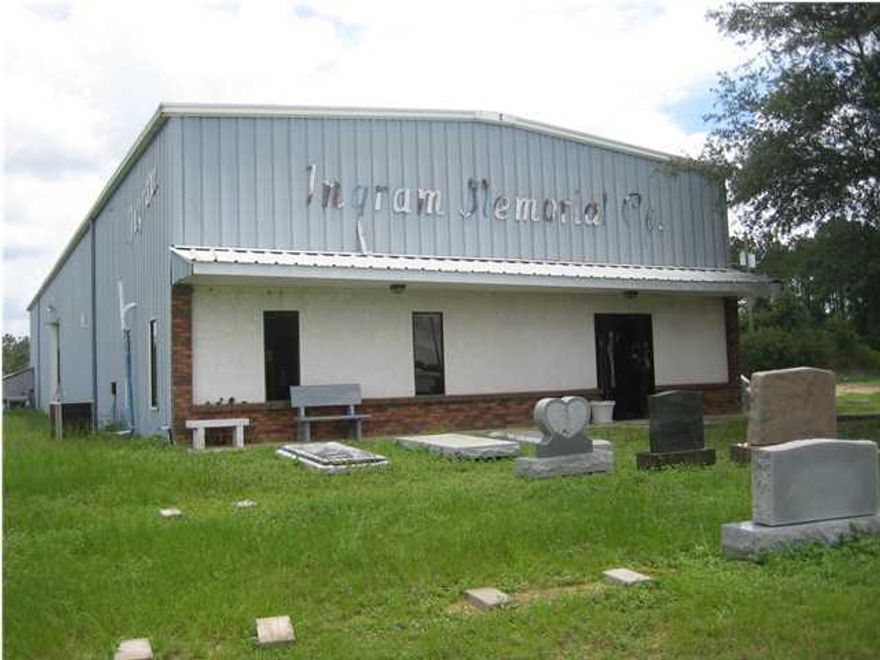 This property is zoned Light Industrial and has been used in the past as a Memorial and Monument business. The 3500+/- square foot metal building is located on 4.466 acres of mostly flat, cleared land. The equipment, marble headstones and other personal property does not convey with the sale of this property.