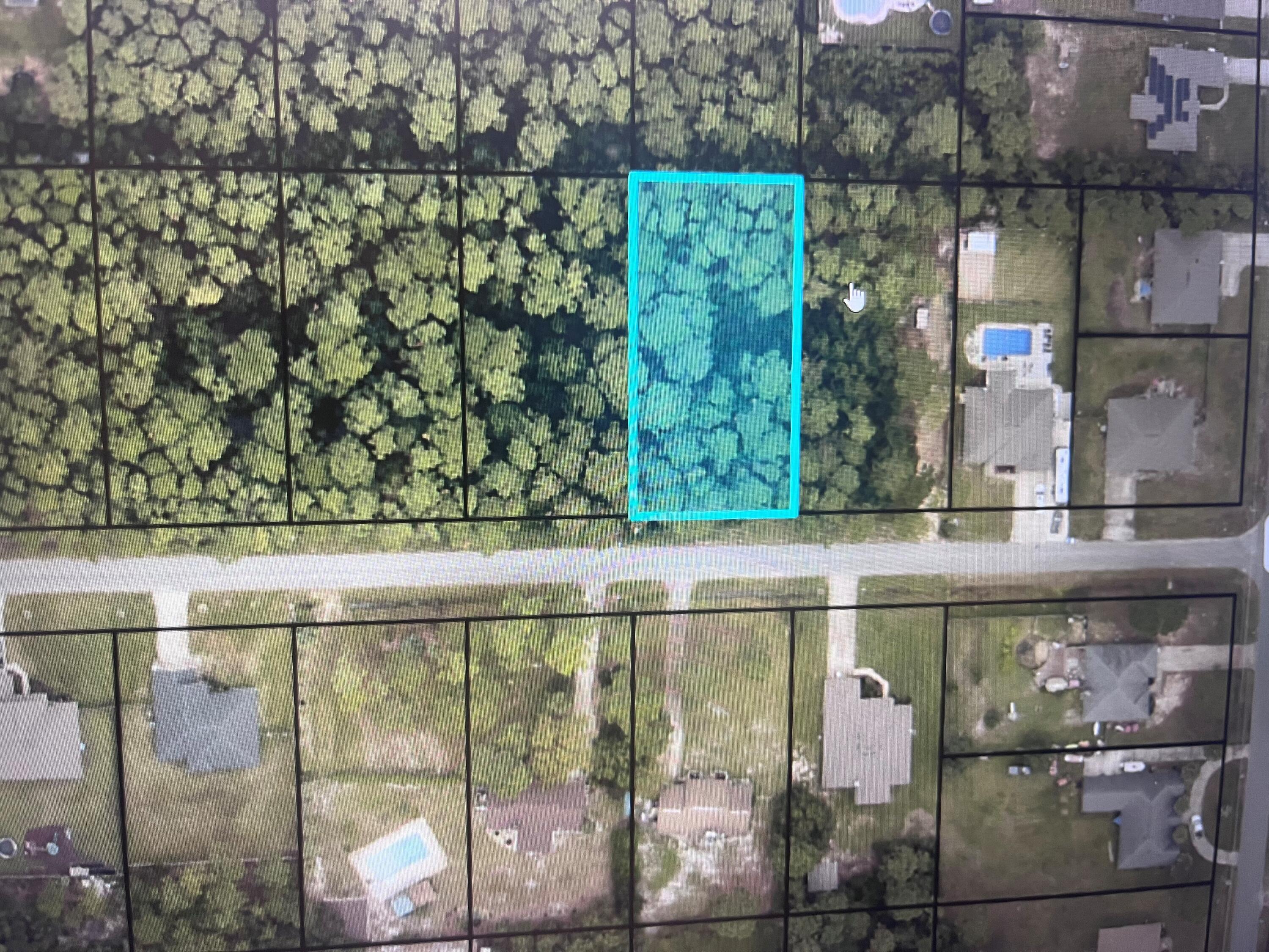 Imagine building your dream beach house on this wooded vacant lot which is located just a short drive to the beautiful beaches of Navarre. This undeveloped property offers the perfect canvas for your custom-built home, allowing you to create a unique and luxurious coastal retreat. This lot is 10 minutes of driving time to Navarre's beautiful white beaches and 1 mile from shopping and dining areas. No HOANot considered wetland. Wetland Report is available if requested.
