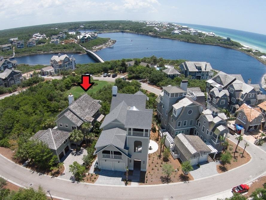 This Tom Christ Designed home has been recently furnished by ASID Designers, Tina Vital and Bevin Cole James of Abode Design and is within 200' of the most beautiful boardwalk to the beach you may ever find! And the only thing between the back of this home and the Bridges Pool is a Park! Sellers purchased this home when it was one of only three homes in Bridges! Exterior finishes include a combination of wood lap and shingle siding and a wood shake roof with copper flashing. Inside, is a 16' x 26' Great Room with 10' Vaulted Wood Beam and Panel Ceilingswith Masonry/Gas Fireplace and opens to a spacious porch with a stairwell leading to the first floor screen porch offering secluded, wooded views of a park. With first and second floor Masters, this home will accommodate large families.
