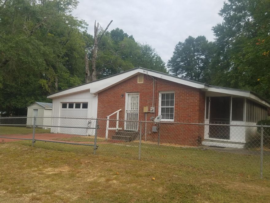 Handy Man Special! Awesome lot, fully fenced in yard, screened in front porch, on a corner lot, with just a little TLC this would make a cute starter home.