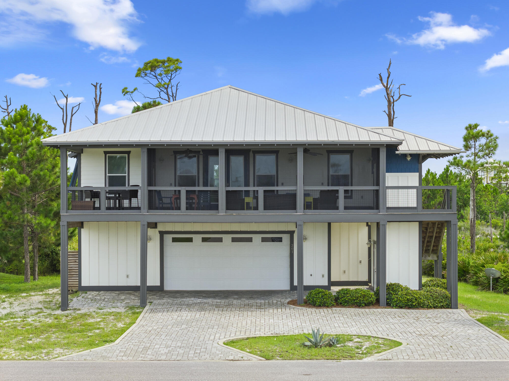This North Cape San Blas vacation home gem checks all the boxes! Gulf side, Dedicated Beach Access via Secluded Dunes, with beautiful views of St Joseph Bay. Located in the Gated community of Park Point at Secluded Dunes on North Cape San Blas, this subdivision is surrounded on three sides by St Joseph's State Park and additional conservation area. Less than 5 minutes to the park entrance with more beach and bay access options as well as a fully functional boat launch. Park Point also has a community pool as well as a dedicated beach access that meanders through beautiful coastal oaks and terminates at a very wide beach on the North Cape. Home has an open floor plan with vaulted ceiling and sky lights for a warm and welcoming feel. The spacious living and dining areas as well as a computer desk office nook flows well and is very functional. Kitchen with breakfast bar that has beautiful granite countertops and cabinetry. 4 bedrooms with 3 en suite bathrooms gives one privacy options throughout, while the 4th bathroom is easily accessed by guests. A large, well furnished, and full length, screened front porch is completely screened and has beautiful views of St Joseph Bay and the undeveloped state park. The lower level is accented by a brick paver driveway and natural landscaping. The enclosed garage is set up more like a huge bonus fun room that is appointed with; finished floor, sitting area with TV, ping pong table, cabinetry, additional functional space. Adjacent is the large bottom back screened porch complete with; large swim spa, grill, dining area ,and outside shower. Take a moment to view our 360 tour and feel free to ask for your virtual or private showing. Currently a vacation rental so this listing is appointment only. New buyer fee is a percentage of sales price, ask agent for details. Some dimensions were obtained via the Gulf County Property Appraiser's website. Please verify if important.