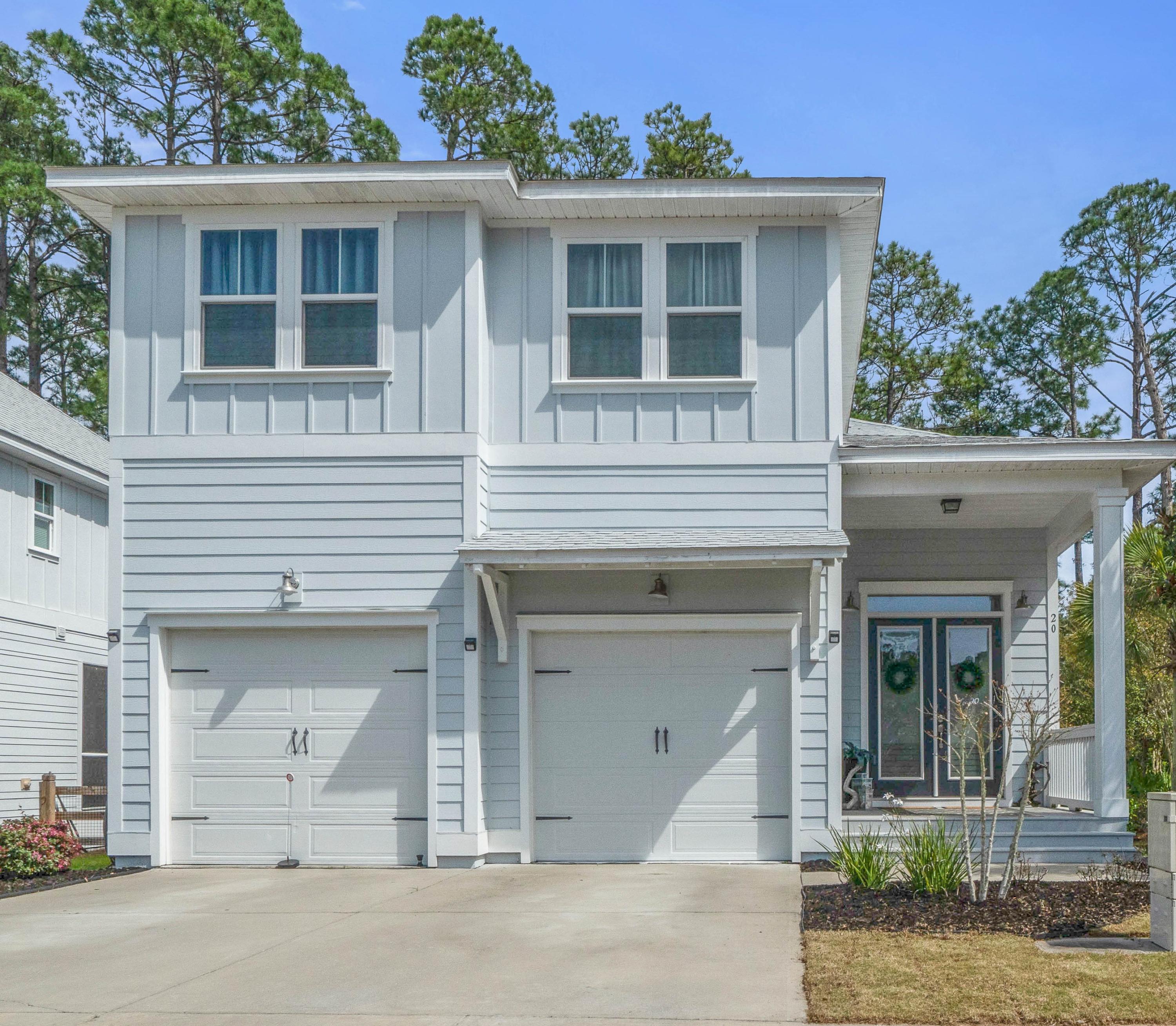 Watch the Virtual Tour!! Paradise awaits in this stunning home in the charming Audubon Point community. With warm, upgraded wood flooring, stunning granite counter tops, and covered porch overlooking the private backyard. Fall in love with the 9' ceilings, crown moulding, tray ceilings, open floor plan, and spacious bedrooms.The backyard is fenced and has artificial turf for low maintenance and easy living.With beaches close by and Eden Gardens State Park only 2 minutes away, you need look no further for your dream home and location! While you are in the neighborhood, be sure to view your new community pool and gathering area.