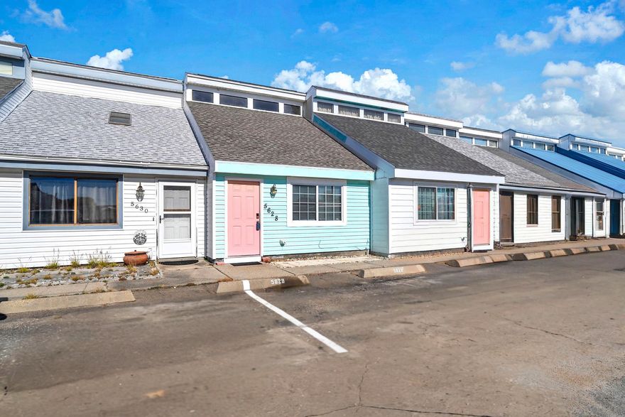 RARE OPPORTUNITY! ONLY 450 STEPS FROM THE BEACH with NO HOA. SHORT TERM RENTALS ARE ALLOWED! ALL FOR UNDER $300K!! This is your opportunity to have an affordable home or investment across the street from the world's most beautiful beaches!! This adorable townhome has two bedrooms, one and one half baths, 4 year old roof, new granite countertops in the kitchen, no carpet, cute back yard area, fresh paint throughout. The only thing missing is you! This is a must see that will not last long! Call your favorite realtor to schedule a showing! All information is approximate and should be verified by buyer if important.