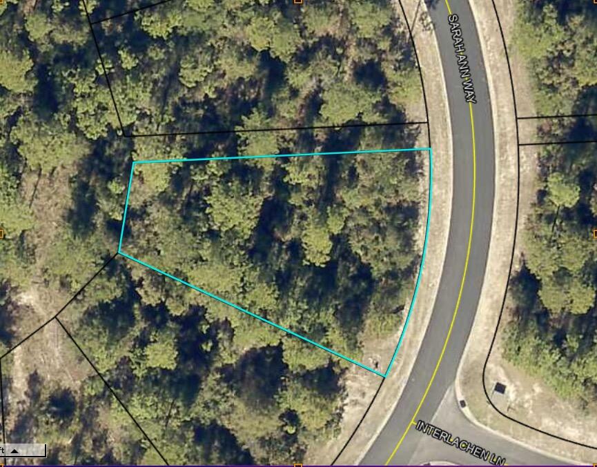 Build your dream home! This .36 acre lot is located in Heritage Plantation.This lot has a wooded common area behind and on one side of it. Heritage Plantation has sidewalks, green spaces, and ponds, and is convenient to Crestview for shopping and entertainment. Make this neighborhood your home! Buyer to verify all information.