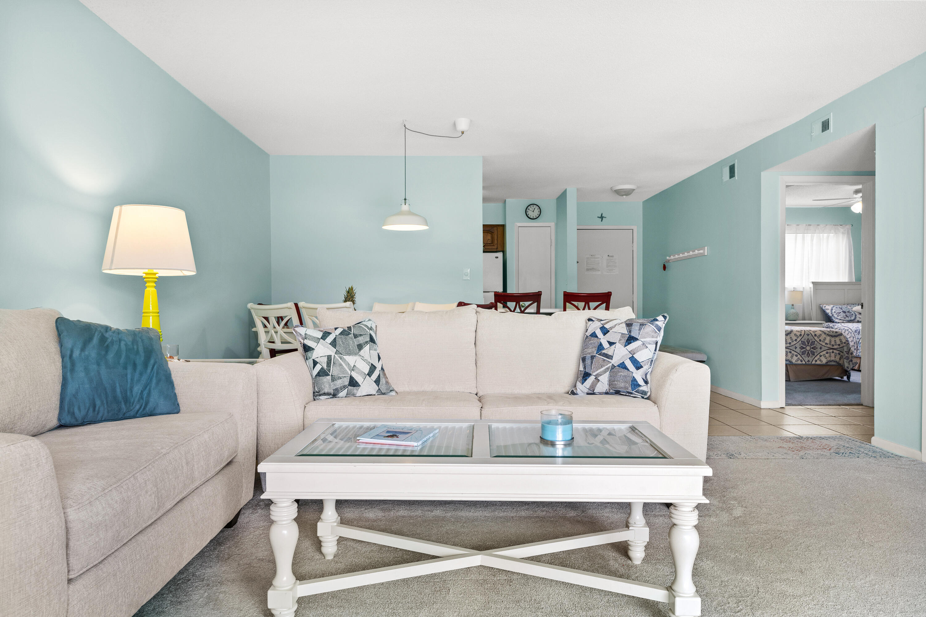 The allure of the Gulf of Mexico's powdery white sands and crystal-clear emerald green water is just 200 yards away from this turn-key property. Not only is it ready for immediate occupancy but also presents a remarkable rental projection over $45K.This 2 Bedroom, 2 Bathroom unit is being sold fully furnished with a brand-new couch and loveseat, A/C replaced in 2021, new Roofing & Gutters in 2022. This ground-level residence epitomizes coastal living with its proximity to the deeded, private beach with gated access and a host of desirable amenities including pickleball, community pool, tennis courts, and clubhouse. Also, there are miles of bike paths, 3 shopping malls, walking distance to 4 restaurants and many golfing options. Take a look at the video to see how close the beach is.
The unit has nearly 1100 square feet of furnished space and is one of the few in the community with a south facing, extended, private patio for outdoor enjoyment. The spacious kitchen features a convenient breakfast bar that transitions into the dining and living areas, perfect for entertaining or relaxation. Accommodation includes two large bedrooms and two full bathrooms, offering ample space for residents and guests alike. The master bedroom has a king size bed and its own en-suite for privacy. The guest room has 2 queen size beds to accommodate additional guests and to maximize rentals.
Parking is a breeze with an assigned parking spot directly outside the unit. Additionally this unit is located by the tennis court and just across the driveway from the community pool, playground and grilling stations. Chateau La Mer ll has it all for permanent residents and for vacation renters.