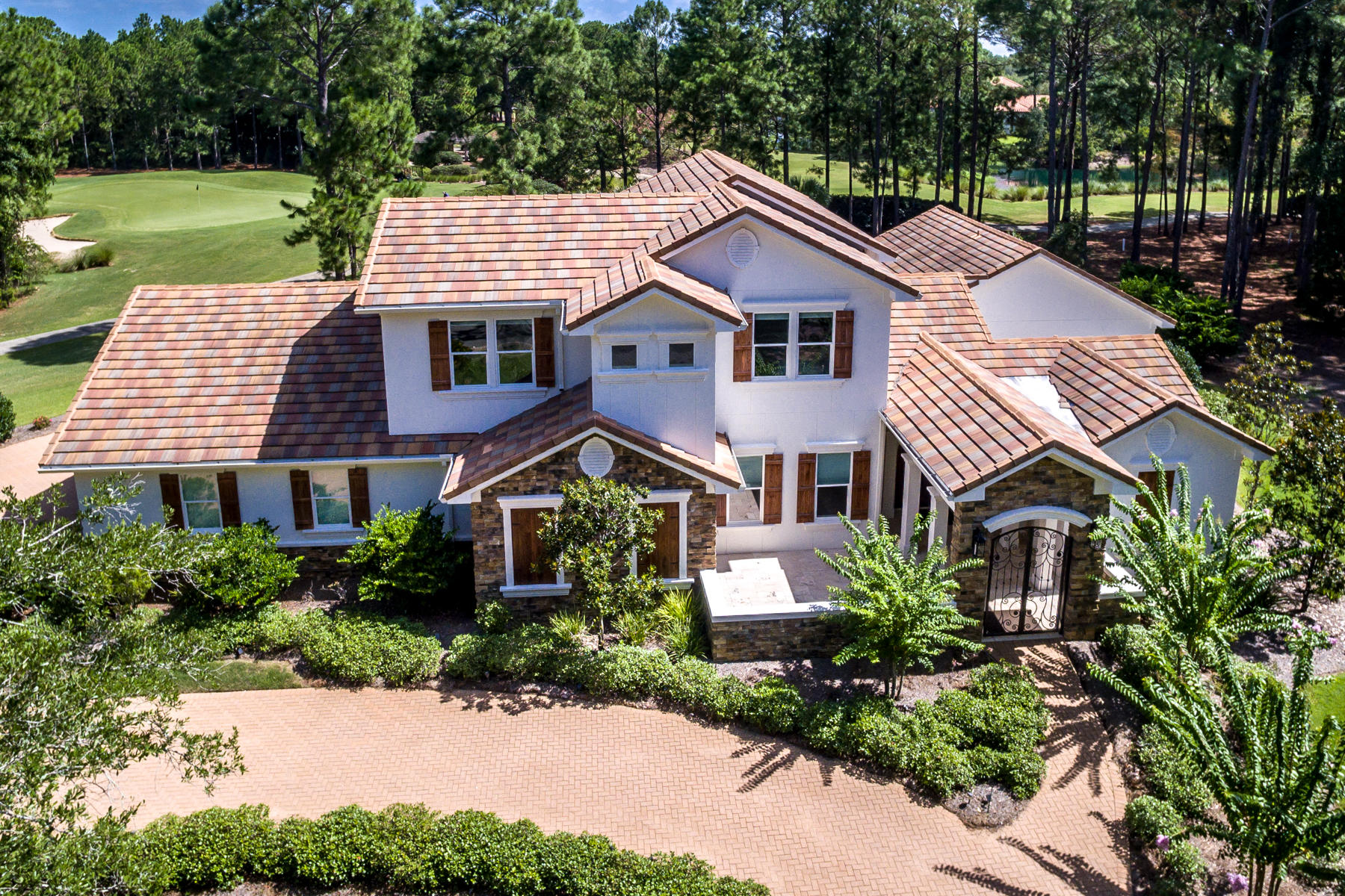 Awesome Golf Course home, settled on the Green of #13 and the Tee Box of #14 of The Raven. This spectacular home has it ALL including LAKE Views and lots of privacy! Spacious open floor plan with french pattern Travertine floors downstairs and wood floors upstairs. Large spacious kitchen with cook top, double oven, 2 new Miele Dishwashers, Miele built in coffee/cappuccino/expresso maker and new Sub Zero refrigerator. Kitchen, living areas and master bedroom over look screened in saltwater pool & hot tub, SPF 15 screened in Lanai with UV protection in, while keeping pine straw out! Whole house generator (48KW) conveniently powers the entire home and pool and was just installed in 2019. More features include: Cox Home Life Security, Sonos Sound,