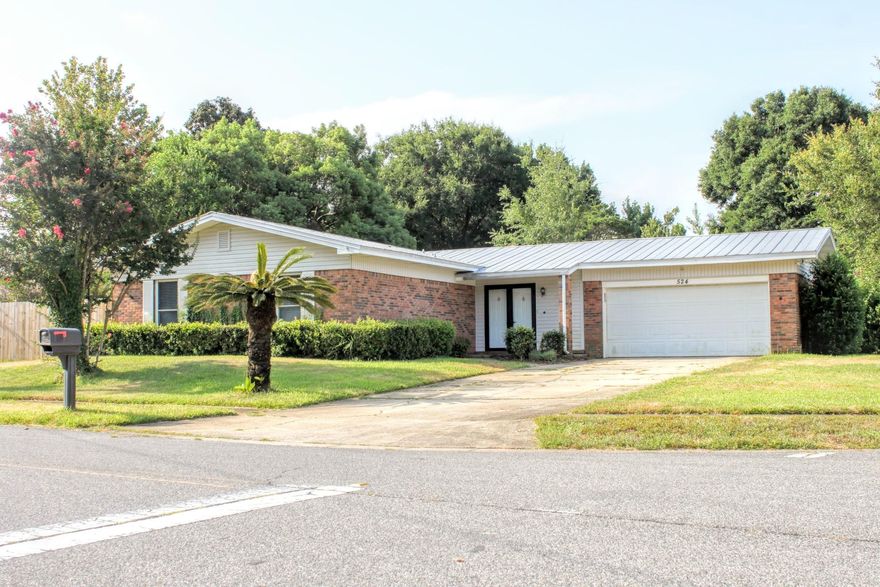 PRICE REDUCTION ON THIS AFFORDABLE BRICK HOME LOCATED IN THE HEART OF DESTIN! This 3 bedroom, 2 bath single story brick home is on a large corner lot and is centrally located to shopping and restaurants and only 2 blocks to Destin Elementary School. The kitchen has been updated recently with granite counters and stainless appliances. Home features a 2 car garage, fireplace, Florida room, and has a fenced yard. Brand new condenser. Great for a primary residence or rental investment. You can get to the Marler Bridge and Midbay BridGe without having to get on Hwy 98. Buyer shall verify all dimensions.