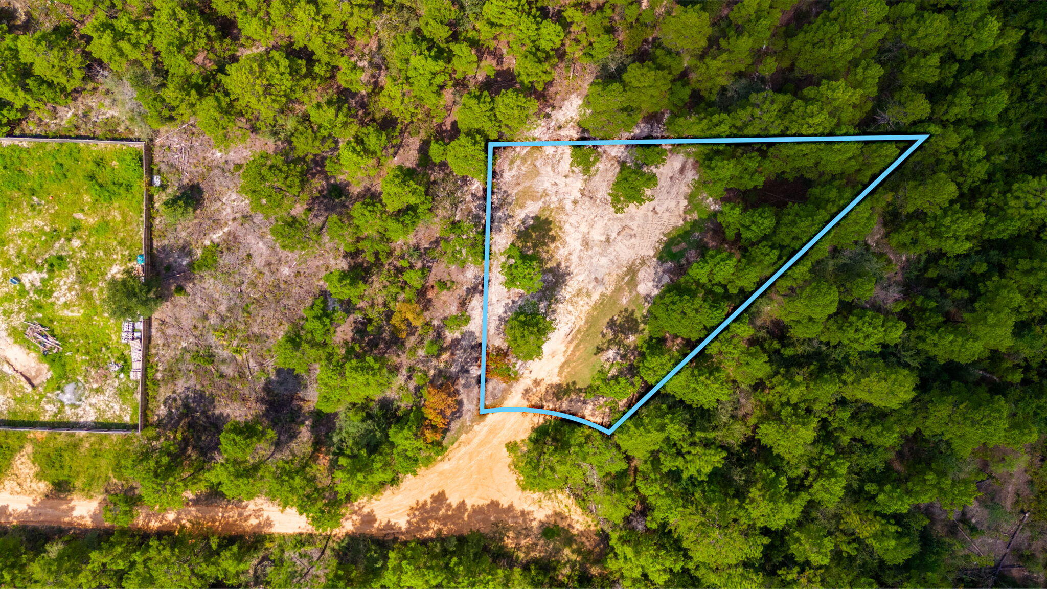 .24 acre lot in Oakwood Hills Unit 3. Minimal restrictions mean ample possibilities against a wooded backdrop. Lot is mostly cleared with some trees left for aesthetic purposes. Manufactured homes are allowed. Level, flood zone x, & no wetlands according to the county GIS map. There are no utilities currently present. A well & private septic would be needed. Property is located on a private dirt road about 450 ft from a paved county maintained street. Take note that the property appraisers parcel photo shows structures & debris that have been removed.