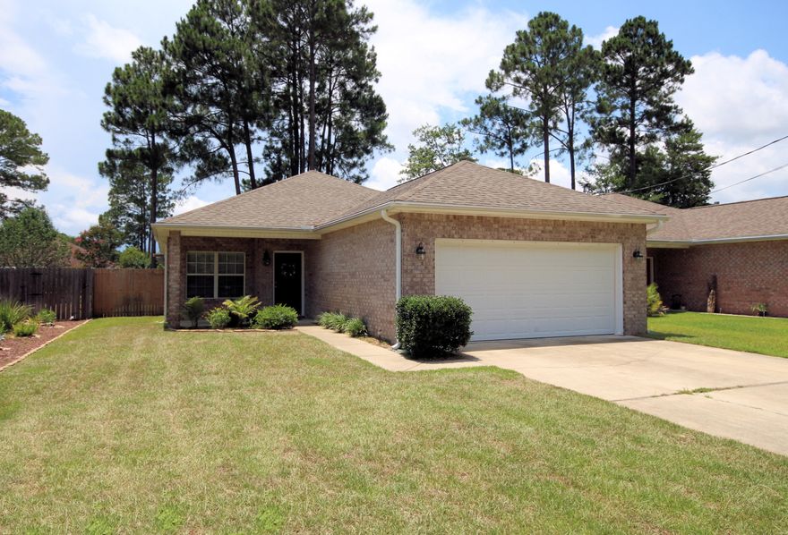 This gorgeous 2005 home has TWO living areas, a spacious kitchen with granite counter tops, new stainless appliances, new paint throughout, new carpet in the bedrooms and one living room, a large master suite with double vanities in the master bathroom, garden tub, and enclosed toilet. One living area flows into the kitchen, making this the ideal space for additional seating and entertaining. Use the large nook for your office needs, or a play area for the kids. The possibilities for this open space are endless! The kitchen opens to the back porch, which is covered by a lovely pergola, from which to enjoy the peaceful backyard, complete with privacy fence, a shady pine grove, and new sod. Buyer to verify all dimensions and data.