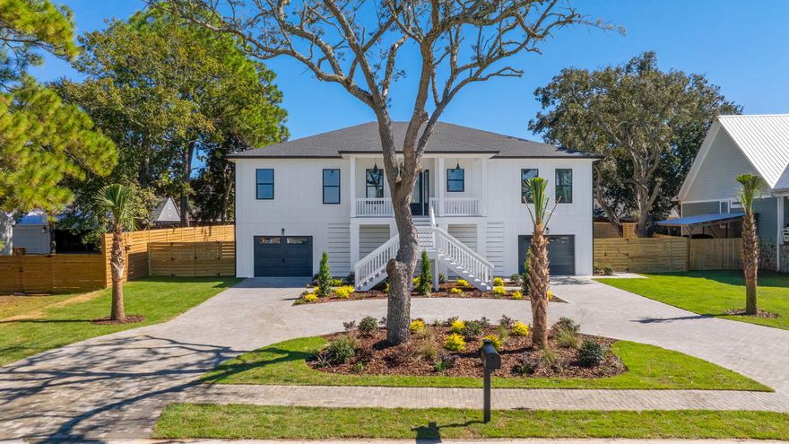 Location, Location, Location is the first key feature that comes to mind when thinking of this amazing new build dubbed your next home. It's located within a hidden oasis of Shalimar steps away from the bay with a view that would drop any jaw. The builders took their time on this one as its whispers luxe with 10 ft ceilings throughout, crown molding, Kitchen-aid appliances, white Carrara countertops, 4 car garage tandem parking, Custom walnut shelving throughout, Custom marble accent wall with 75-inch electric fireplace and 85-inch TV, covered front and back porches perfect for evening sunsets and morning coffee, tankless gas water heater with recirculation pump, Generac generator, driveway concrete pavers, landscape carpeted with zoysia grass and conduit already in place for future landscape lighting. Open cell insulation in attic and closed cell underneath floor area which helps with electric bills. The home's finished floor elevation is 3.9 ft above the AE flood zone so great for homeowners' insurance premiums.  8-foot solid core doors throughout.  This beautiful home is only 2.6 miles from Eglin AFB, 20 miles from Duke field, 10 miles from Hurlburt field, less than 4 miles from Destin's beautiful white sand beaches, less than 3 miles from highly rated schools and less than 2 from shopping centers and amazing eateries!! Schedule your showing today, this brand-new luxe home will not last! 4 bedrooms plus 1 flex / Office! Plenty of storage space & room for golf carts! 