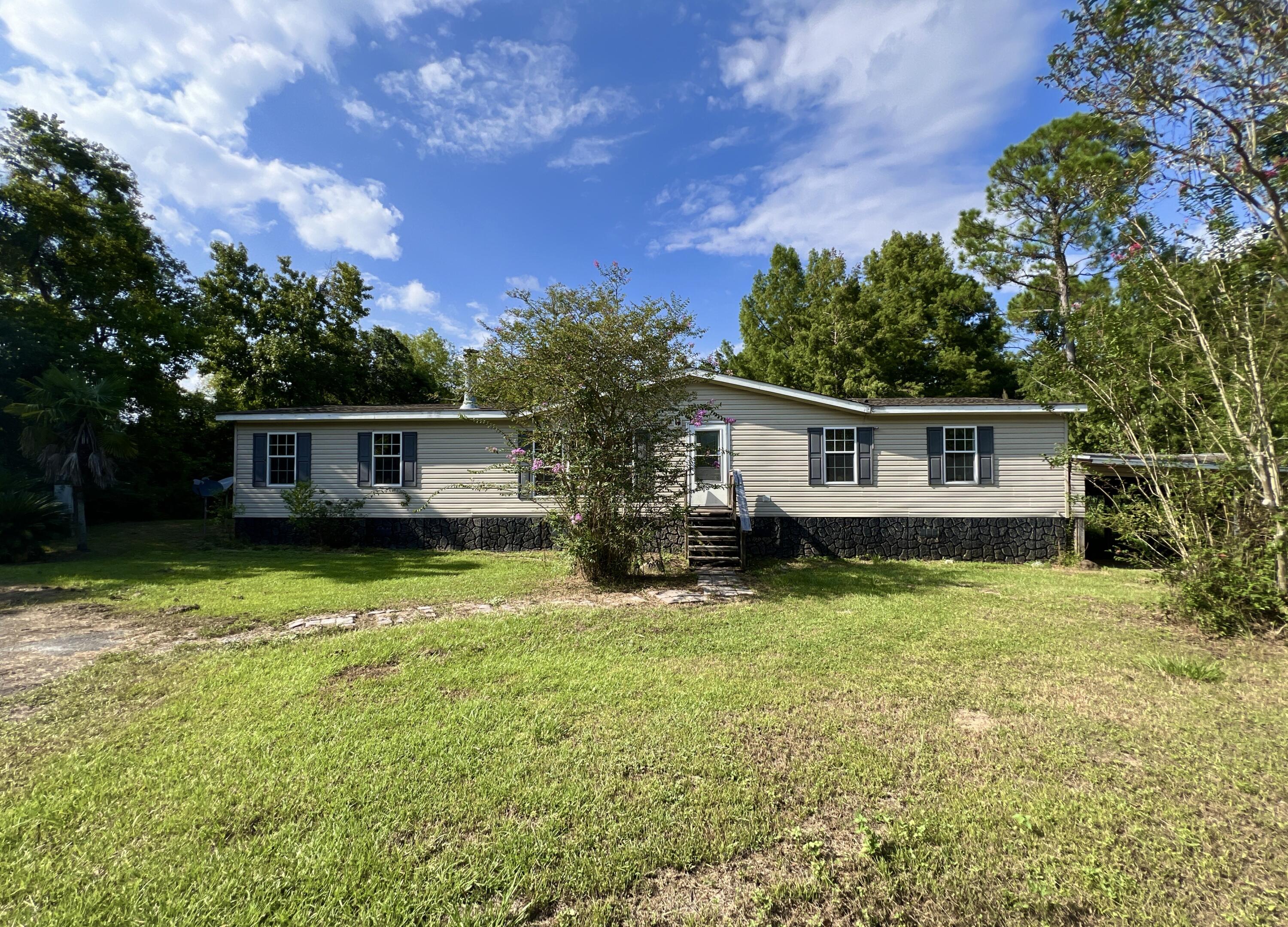 This is a 3-bedroom, 2-bathroom REO mobile home was built in 2005 and features a split-bedroom layout, with the master bedroom just off the living room and the remaining rooms just off the kitchen.  The home includes a fireplace, is situated on a spacious 0.8-acre lot and has chainlink fencing around the exterior of the property. Due to repairs needed, this home will not qualify for all financing, therefore cash or rehab loans. There are several loan programs that are available for owner occupants looking to finance repairs. Call today!