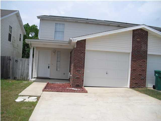Investor's Opportunity! 3 bedroom/2.5 bath town house in Green Acres area of Fort Walton Beach. Town house offers end unit with a garage and fenced in backyard.