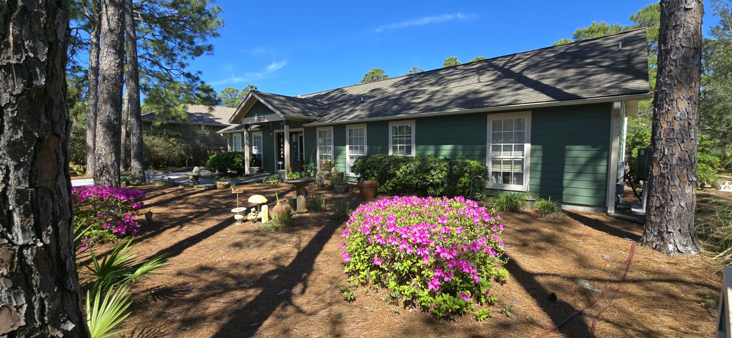 Live at the beach and at the end of the day retreat to your quiet residential setting that backs up to the state protected forest; where the deer, birds and squirrels play. This lot has a 80' deep, 100' wide open backyard with an out building, fully insulated w/ac and heat - perfect for an art studio, workout room or transform to a suite.Home has 11' vaulted ceilings that add to your comfort - located south of 98, 30' above sea level and less than a mile to the gulf. With this listing being one of the original platted lots and neighborhoods in the area, lay your roots in Santa Rosa Ridge today! $15K paint allowance!