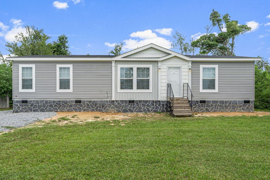 : You'll fall in love with this charming mobile home located in the heart of Callaway! Sitting on a large .64 acre lot, this 1 year old property still smells brand new! Walls are drywall (not wall board), and the home has been equipped to be energy efficient. Stainless steel appliances and walk-in pantry adorn the kitchen and a Culligan reverse Osmosis system provides fresh water. The brand new well is also filtered by a Culligan softener (owned) and a Simply Safe Security system also conveys with the home. Cost for the security subscription runs about $30 a month. All bedrooms have walk in closets. Skirting along this gem is stucco and the septic tank was just inspected in 2022. Restaurants, shopping, and schools are all within 2 miles, Hospital is 5 miles, Tyndall Air Force Base is 7.4