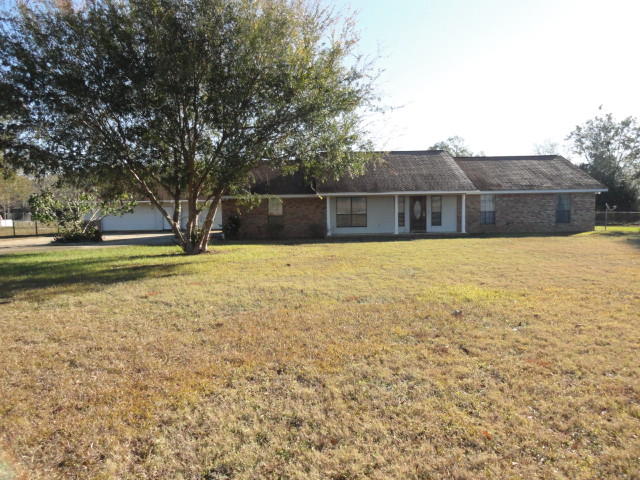Saddle up your horses and stop in Baker on 3.57 ac. This is a Horse/Farming community. The property has pasture for horses and a drive through barn. This all brick home has a 2 car attached garage and a 4 car detached garage/workshop. The garage workshop is plumbed for a full bathroom. This home has an open floor plan with hardwood floors, tile and 2 bedrooms with carpet. There is a large laundry/mud room as you enter from the garage. Large windows allow lots of light to flood the home. The large screened porch is ideal for entertaining or just relaxing. The porch is a great place to enjoy your morning coffee and sunrise. The barn and rear pasture area are accessible from Hester Church Rd.