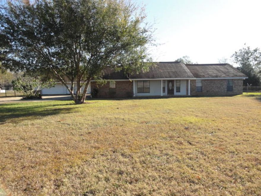 Saddle up your horses and stop in Baker on 3.57 ac. This is a Horse/Farming community. The property has pasture for horses and a drive through barn. This all brick home has a 2 car attached garage and a 4 car detached garage/workshop. The garage workshop is plumbed for a full bathroom. This home has an open floor plan with hardwood floors, tile and 2 bedrooms with carpet. There is a large laundry/mud room as you enter from the garage. Large windows allow lots of light to flood the home. The large screened porch is ideal for entertaining or just relaxing. The porch is a great place to enjoy your morning coffee and sunrise. The barn and rear pasture area are accessible from Hester Church Rd.
