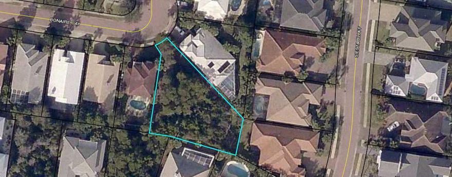 Watch the Video in the Photos tab. Click the photos tab, then click the video tab! You'll love it! Bigger lot in the sought after gated neighborhood of Destiny East! Nice amenities including a Theater, Clubhouse, tennis court, fitness center, community pool, hot tub, BBQ area, putting green, playground, walking path, and basketball goal! Short Term Rentals are permitted. Walk to the Beach! Build your dream home and live at the Beach! All dimensions are approximate and should be verified. Most of the neighborhood has been built. There are only a few lots left and this is one of the biggest!