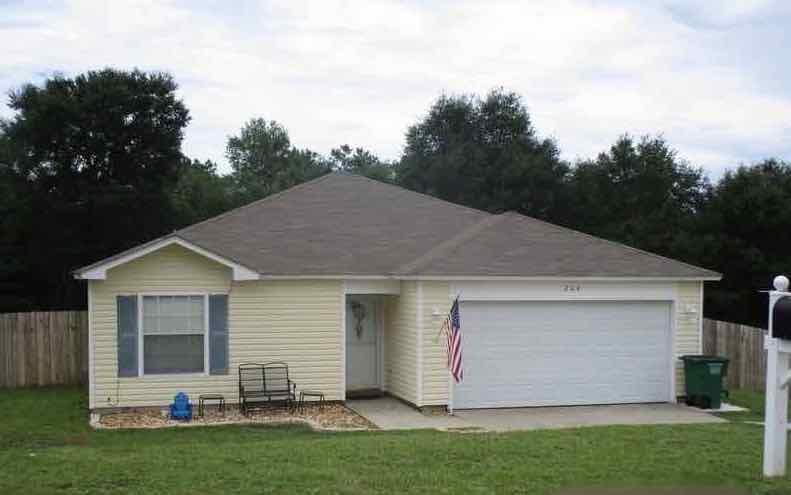 Convenient and priced to sell! This 4 bedroom 2 bath home is ready to be called home! Built in 2005, this 1244sf home has split bedroom design, vinyl siding, privacy fenced back yard and 2 car garage. Home has tiled floors in wet areas, laminate floors in the living room and carpeted bedrooms. This popular neighborhood is minutes from both North and South Crestview and has tons a potential. Purchase this property for less than you'd pay in rent! Call today before this one is gone.