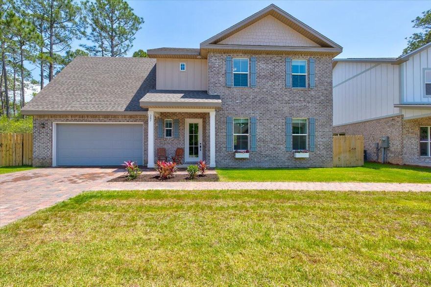 An exceptional brick home, newly constructed in 2020, privately nestled to forest preserve. This house offers an open concept floorplan, vinyl plank flooring and a main level bdrm.. The kitchen features soft close white cabinets,  quartz countertops, stainless appliances, and a unique pot filler. The upper level boasts a huge bonus room; Master bdrm with ensuite bath - featuring a separate shower, a free standing bathtub, walk in closet and a separate ''his'' closet.. The finishing touches to this 4 bedroom, 2.5 bath include fresh paint, crown molding, energy efficient A/C units for each floor, plenty of pantry space, and additional closet space under the stairs. A fully fenced back yard; irrigation system complete the outdoors. A great location has you minutes to the beach or the bay!