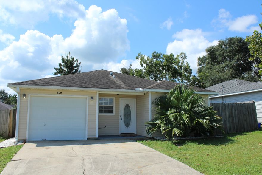 Adorable 3 bedroom 2 bath home with a one car garage and 1128 sq ft! This home is a short drive to Eglin Airforce Base, 30 minutes to the beaches and is located south of I10! The home has a great OPEN floor plan! The kitchen opens to the living room and eat in dining area! The kitchen features a side by side refrigerator, stainless and black stove, and range hood! The eat in area has sliding glass doors that lead to the open back patio! The kitchen and eat in area have views of the fenced in back yard! The master bedroom has an ensuite bathroom that features a double vanity, tub/shower combination, a large walk in closet with shelving, and a separate water closet.  There are two additional guest bedrooms and a full hall bathroom. The laundry has a separate space in the garage with a