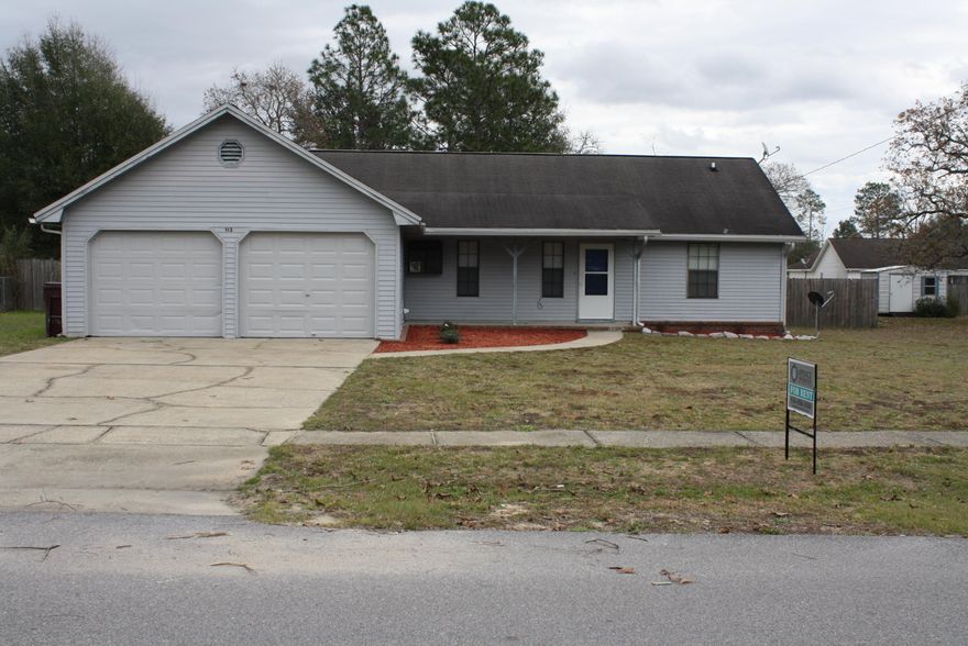 This is a 4 bedroom, 2 bath home with a garage and HUGE backyard! As you enter the tiled entry way, you will overlook the large living room with wood flooring, double glass doors, fireplace, double ceiling fans, vaulted ceilings, and freshly painted walls. There is a formal dining room with tile floors that opens into the kitchen. The kitchen features an electric stove, dishwasher, breakfast bar and side by side fridge. The bedrooms are a split floor plan with the master boasting vaulted ceilings, ceiling fan, glass doors, wood flooring, and a tiled bathroom. Two additional bedrooms feature wood flooring, and newly painted walls. The fourth bedroom is located just outside the garage entry door and is spacious and heated and cooled. This property is finished off with a storage shed.