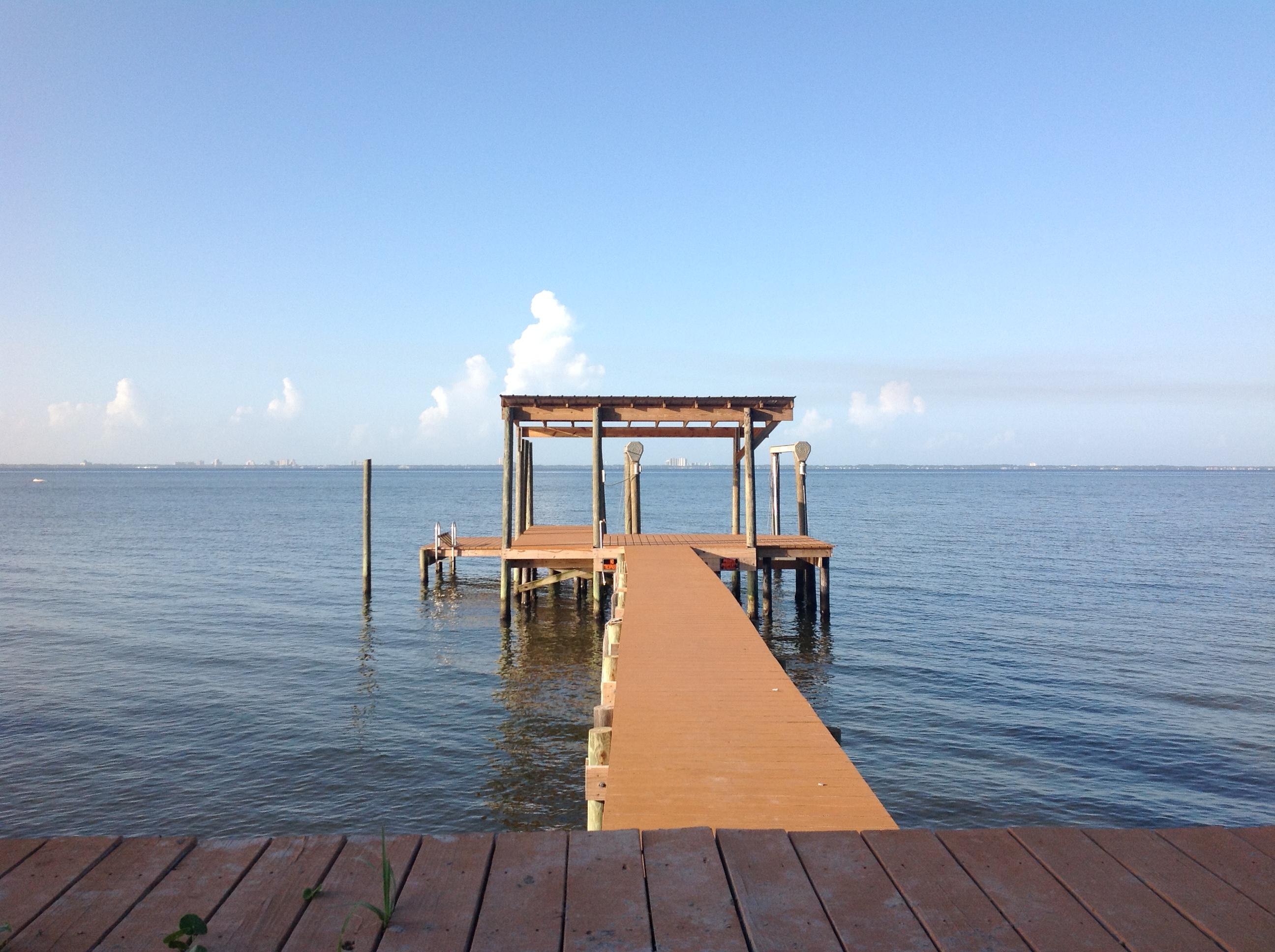Waterfront Paradise! Owner has updated the interior to be your perfect get-away. Features magnificent views of Choctawhatchee Bay and Destin. 100' dock and covered boathouse, heavy duty lift to keep your boat high and dry all bulkheads and riprap redone and reinforced. The kitchen/living room and the master bedroom showcase custom designed bay window views of the sunrises and sunsets on Choctaw Bay. Cedar window boxes under the bay windows in the master bedroom double as both seating and storage. The master and second bedrooms are large with good closet space. You will enjoy the updated, open kitchen and living area with terrific views. The Florida room and large back patio are a perfect place to entertain and enjoy the view. Further - the home features lots of storage