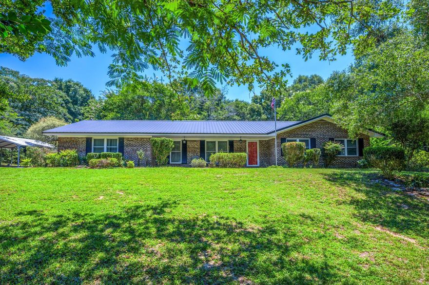Picturesque Setting on this landscaped 2.19 Acres. Newly Painted White Wooden Fence greets you upon your Entrance ~ Tucked Away in North Crestview, but only minutes from town, you can bring your Horses, Chickens or any other pet to this ''One of a Kind'' Family Friendly Home. You'll never get tired of walking the property to your 2-Stall Horse Barn with Loft, Chicken Coop, Dog Kennel or just tinkering in the out buildings doing your favorite hobby. You can't miss the Beautiful Mature Oak Trees one of which has a brand new swing just waiting for you. Upon Entering the home, you enter the Living Room which is adjacent to the Formal Dining Room featuring a Wooden Accent Wall and Updated Lighting. Kitchen has black appliances, tiled floors, granite countertops and Plenty of storage. -( CON'T ) The Main Family Room has a Brick Wall w/Fireplace and a New Double Door that extends out into the Landscaped Backyard. All 3 Bedrooms are located down the same hallway with the guest bathroom being the first door you come to.  Mornings will be spent outside under the covered patio drinking coffee and listening to the birds / X-Large Dome Green House /Come see all the special features this home has to offer and start living your best country life!    AC- 2008  Metal Roof appox 11 yrs Old  (All measrurements are approx, buyer to verify)