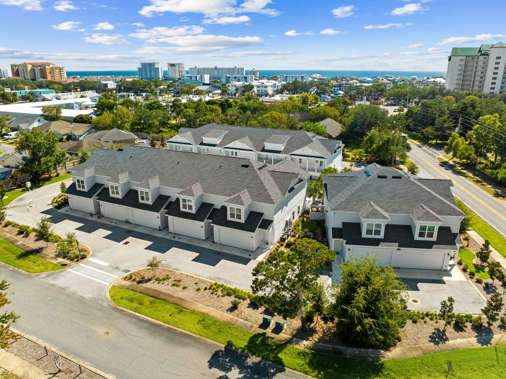 $25,000 furnishing credit available! Ideally located in the heart of Destin, the Beach Lofts community embodies coastal living. Step inside and you're greeted by the impeccable craftsmanship and high-end finishes throughout. With ~1800 square feet of living space, this townhouse offers an open and airy floor plan, perfect for entertaining.The main level boasts 9-foot ceilings and a modern kitchen featuring quartz countertops and ample storage space. Retreat to the primary bedroom with its own window seat and ensuite bathroom. Enjoy the convenience of a two-car garage. Outside, you'll find a spacious courtyard with a resort-style community pool just a short distance to Boshamps and other local hot spots.