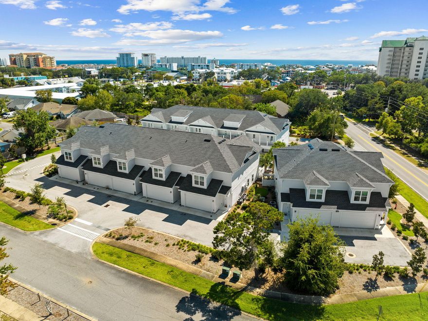 $25,000 furnishing credit available! Ideally located in the heart of Destin, the Beach Lofts community embodies coastal living. Step inside and you're greeted by the impeccable craftsmanship and high-end finishes throughout. With ~1800 square feet of living space, this townhouse offers an open and airy floor plan, perfect for entertaining.The main level boasts 9-foot ceilings and a modern kitchen featuring quartz countertops and ample storage space. Retreat to the primary bedroom with its own window seat and ensuite bathroom. Enjoy the convenience of a two-car garage. Outside, you'll find a spacious courtyard with a resort-style community pool just a short distance to Boshamps and other local hot spots.