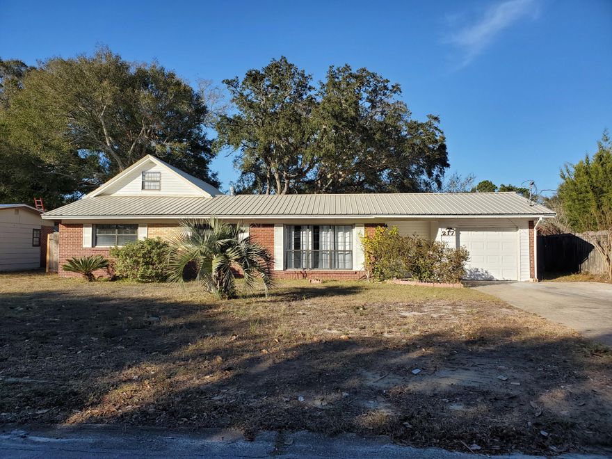 This is it!  Great family home with so much to offer. Remodeled kitchen, large master bedroom with walk-in closet, comfortable den with brick fireplace, and a brand new metal roof!  Around back, you'll find a separate stand-alone H/C space (400+SF) with its own cozy porch; perfect for entertaining, shop, office, hobbies, studio, etc. And as an added feature, there is another bonus space accessed by an exterior stairway - 2nd floor H/C bonus room (500+SF); again ideal for a studio, hobbies, office, or just a quiet getaway. So many upgraded features:  canned lights, new granite kitchen countertops, plank tile in den, double pane windows, and hardwood floors. This is a one-of-kind property ready for your finishing touches.  Come see it soon!