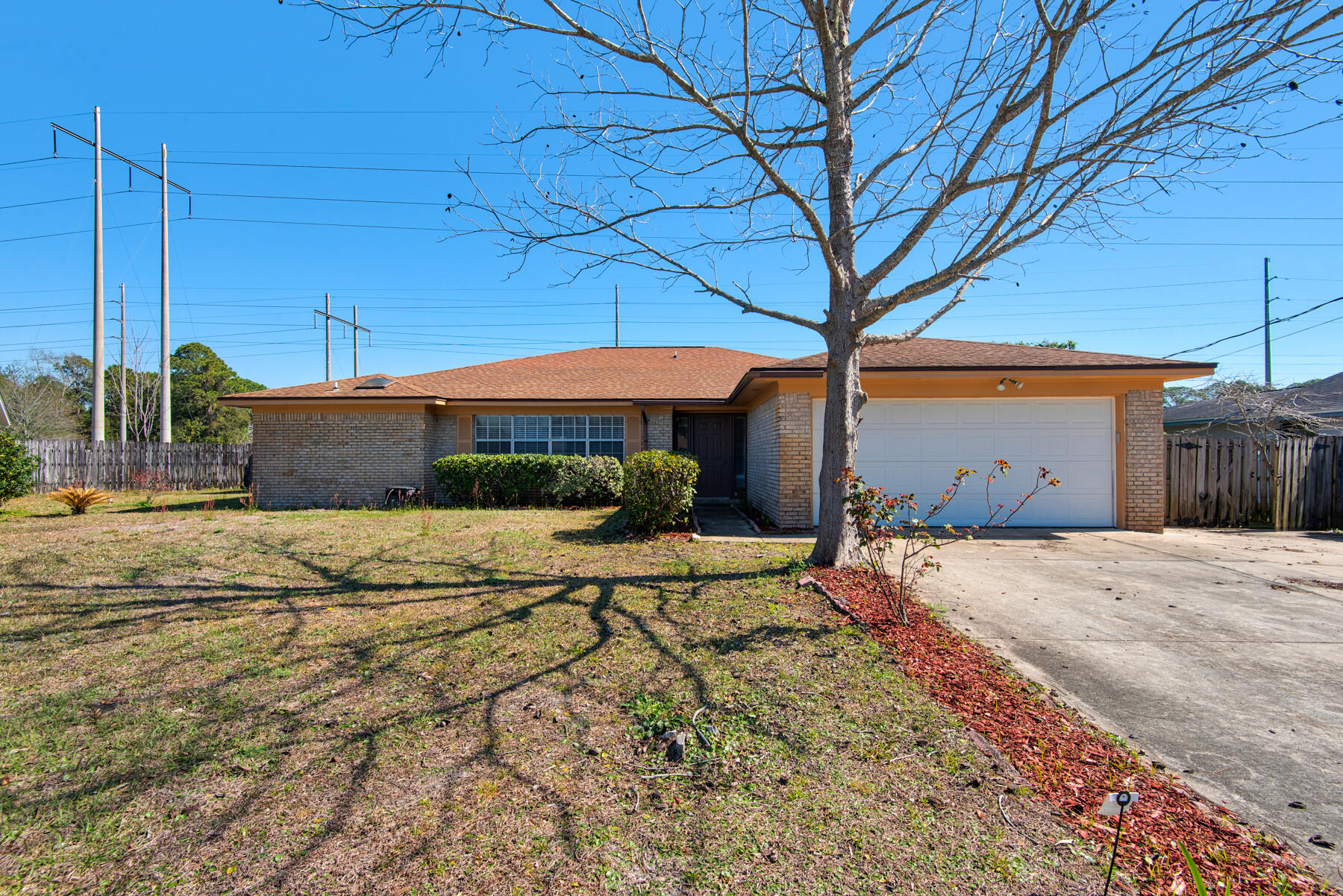 This beautifully maintained single-story home features an open floor plan, ideal for entertaining and comfortable living. Enjoy a spacious living area with vaulted ceilings and a ceiling fan, along with a modern kitchen boasting white cabinetry, stainless steel appliances, and ample counter space. The large primary suite includes an updated ensuite bath with a luxurious soaking tub and walk-in shower. Step outside to an expansive backyard featuring a covered patio, fenced yard, and storage shed perfect for outdoor living. Conveniently located just minutes from shopping, dining, schools, and military bases. All Coastal Realty Services residents are enrolled in the Resident Benefits Package (RBP) which includes renters insurance, HVAC air filter delivery & our best-in-class resident rewards