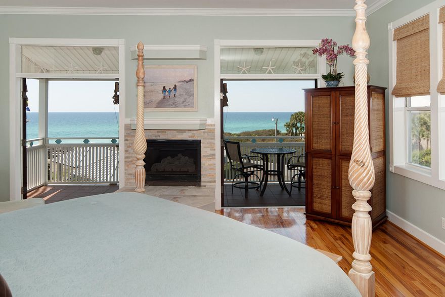 Unobstructed Gulf views can be enjoyed from the second and third floor covered balconies of this fully furnished home in the gated neighborhood of Old Florida Beach, separated from the beach by only two neighboring homes to the south. The nearest private, neighborhood beach access is just over 100 yards away. Inside, on the second floor, its multi-level open living areas are tiered towards the Gulf, allowing the view to be seen nearly no matter which area you wish to enjoy. A modern kitchen is as refreshing as the view with crisp, cream colored cabinets, white Cambria counters and coordinating subway tile back splash. A gas cook top joins a stainless steel wall oven and microwave, as well as a dishwasher and refrigerator. A breakfast bar which comfortably seats four separates the kitchen from the dining area. Hardwood floors carry into the living room area with Cambria topped wet bar and fireplace flanked by French doors crowned by light-filled transoms. A recent addition added a bunk room and its generous private bath with glass enclosed walk-in shower clad in shimmering aqua colored mosaic tile. The master suite occupies the entire third floor of the home. Like the living room, the master bedroom features hardwood floors and its very own fireplace flanked by French doors that lead out onto a private covered balcony whose expansive views are amplified by the added elevation. The westward orientation of the home allows it to capture breathtaking sunsets over the Gulf. The exceptional master bath is a serene oasis encrusted in varied marine shades of mosaic tile work. A glass enclosed walk-in shower joins a separate jetted tub and twin pedestal sinks. Completing the master suite is a walk-in closet with built-in organizers. Two guest bedrooms occupy the first floor which open onto a covered porch overlooking the shaded back yard with plenty of room to add a private pool if desired. The neighborhood pool is fewer than 250 yards away. Polished terracotta tile floors on the first floor join other features that include unique fans and decorative lighting fixtures. Its freshly painted exterior, recently installed metal roof and beautiful landscaping accentuate its unique, angular architecture. A coveted two-car garage completes this perfect beach house in one of the most private gated, Gulf front neighborhoods along Scenic Highway 30A, perfect for year-round residency or vacation rental. In addition to a neighborhood pool and two neighborhood beach access points, Old Florida Beach is within close proximity to shopping, dining and seasonal entertainment at Gulf Place.