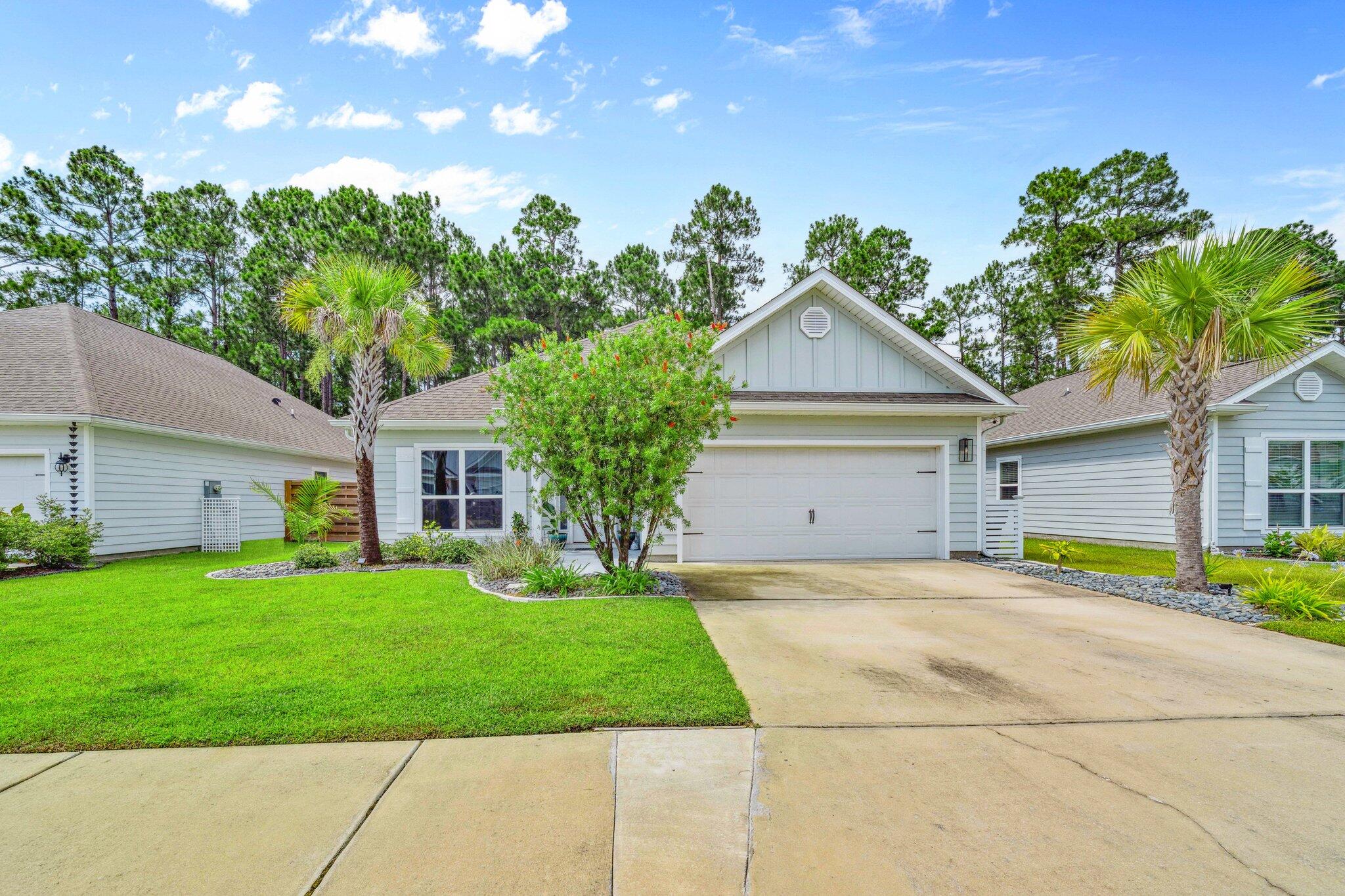 This well-maintained home features a fenced back yard, 2-car garage, and a functional floor plan with thoughtful finishes throughout. The kitchen offers granite countertops, stainless steel appliances, and recessed lighting, flowing into the open living area, ideal for relaxing or spending time with family. You'll love the durable EVP flooring. The spacious master suite includes a large walk-in closet, double vanity, separate shower, and relaxing soaking tub. Step outside to enjoy the covered back patio, great for morning coffee or winding down after a long day.Conveniently located just minutes from The Bay Restaurant, North Beach Social, Farm & Fire, Publix, Ed Walline Beach Access, Gulf Place, and Thomas Pilcher Park. Whether you're heading to the beach, the bay, or your favorite local spot, you're close to it all! Contact us for a private showing or for more information.