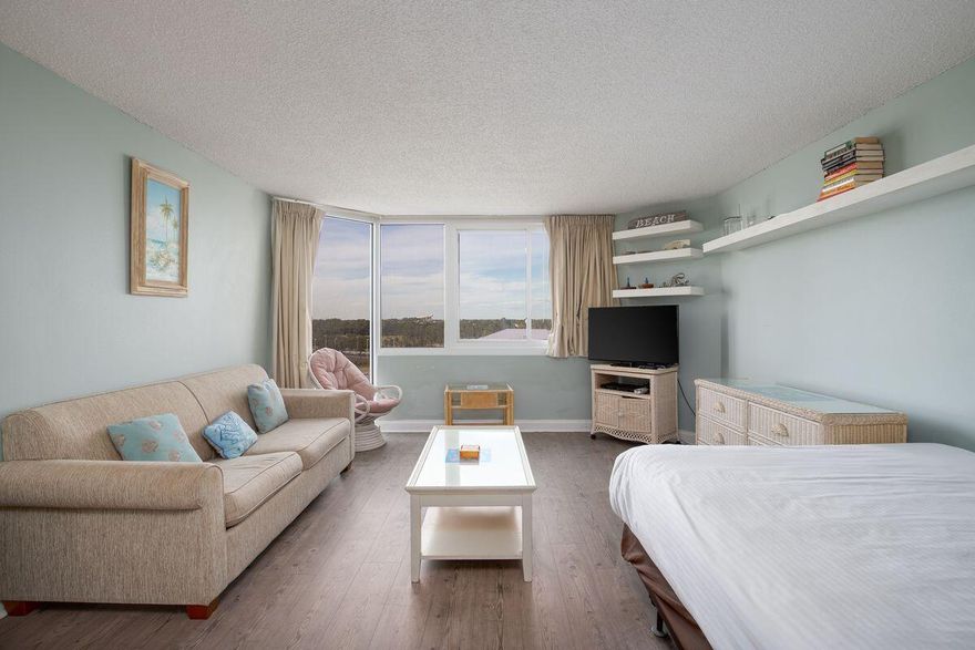 Turn key, fully furnished & rental ready. This is a perfect, affordable second home or rental investment in the world's most beautiful beaches. With nice view of the gulf. This unit features a barn door, large walk in closet.Upgraded kitchen cabinets with granite countertops and backsplash. Stainless steel refrigerator along with lots of cabinet space. Wood laminate flooring has been added. There has been several upgrades in the past years, including NEW exterior doors and windows in all units, complex wide wi-fi, gulf side pool & kiddie pool resurfaced in November 2017 with night time lights, revamped poolside snack bar.