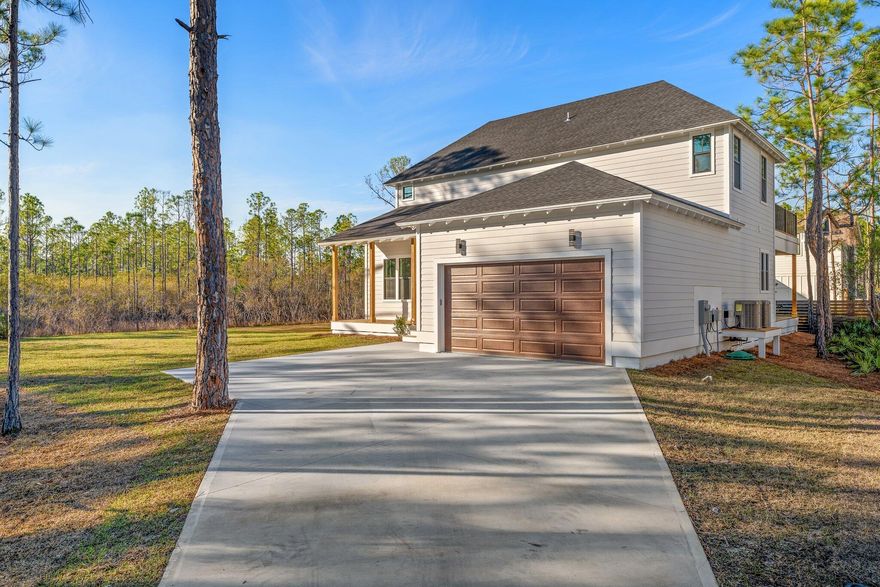 HUGE Price Improvement!  Bring your Boat! No HOA or restrictions.  Two Large Primary Bedrooms & Lots of spectacular outdoor spaces - Brilliant Modern Farm Style Custom Built 4 Bed / 3 1/2 Ba, 2,578 sq ft home in Santa Rosa Beach established on large dead-end lot taking refuge next to State of Florida Land.  Home is within short distance (approx 1/4 mile) to public boatramp providing access to Hogtown Bayou which leads into breathtaking Choctawhatchee Bay.As you enter this home from the craftsman style front porch, you will be greeted with gorgeous wood flooring, 10' ceilings, meticulous custom woodwork and crown molding throughout. The kitchen features a beautiful island complete with abundance of cabinetry and stainless steal appliances. Open Concept Living-Dining room areas.