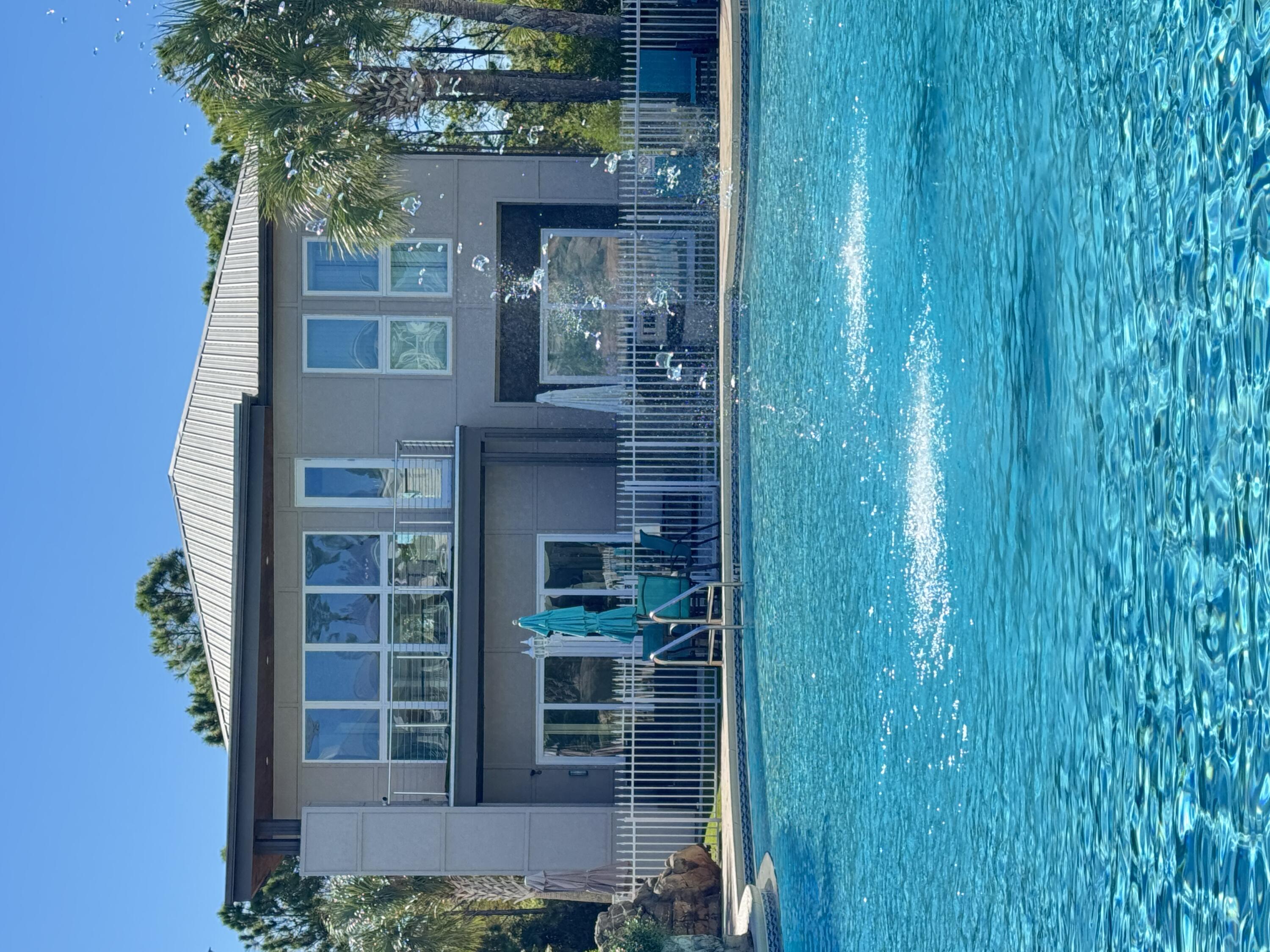 Wake up every day to the serene beauty of a resort-style pool just steps from your back door. This unique home offers exclusive private gate access to the pool and is located in the desirable Cypress Breeze neighborhood. Designed and built by the current owners, this home has never been a short-term renta. Soaring windows flood each room with natural light, creating an inviting and open atmosphere. Blending comfort and elegance, this home is the perfect retreat to elevate your beach living experience. Don't miss out on this exceptional opportunity! Please call (850)800-0100 for inquiries.