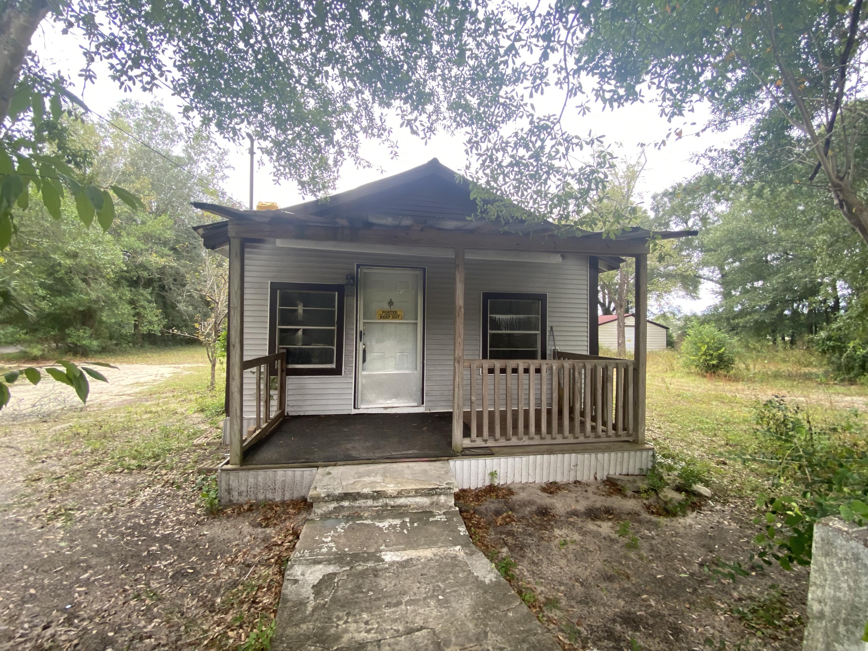 LOCATION LOCATION LOCATION!!!!! Located just a short distance of Twin Hills park, Shopping, Restaurants, and local entertainment. This 2 bedroom 1 bathroom home on .56+/- acre and Dont forget about the Large Shed on the Property! Dont miss out on this GREAT Opportunity.The City zoning for this parcel is mixed use.Being sold AS IS.
