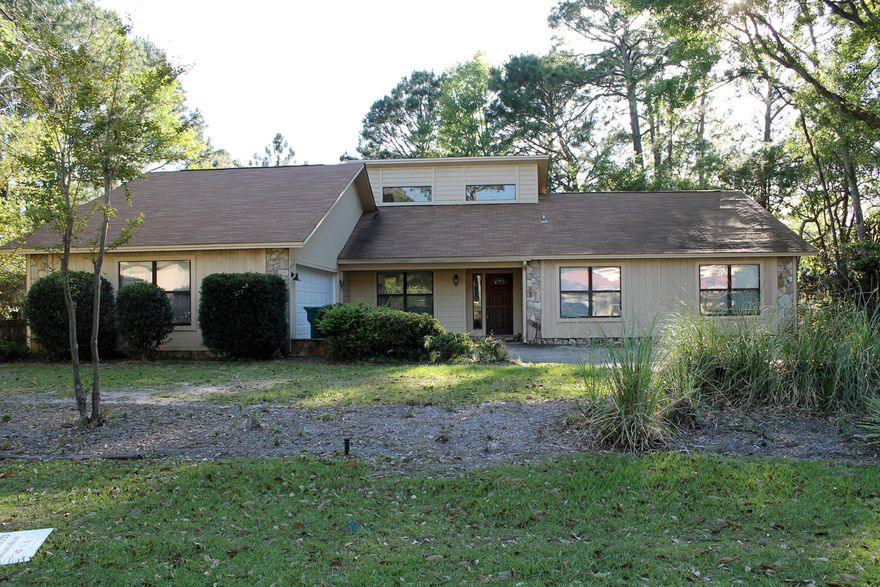 Located on a large treed lot this light and bright 4-bedroom contemporary is an outstanding value. The main living area has vaulted ceilings with a floor to ceiling fireplace. With newer carpeting and neutral paint the home is ready for you to add your special touches. Formal dining room and Florida room for extra living space. Large master bedroom with en suite and walk in closet. Beautiful treed yard, large enough for a pool, fully fenced for privacy. Sprinkler system with lawn pump, too. New air conditioning system was added 4 years ago and new carpeting 3 years ago. New roof to be installed prior to closing. The gated community of Windward has it's own private bay front beach to compliment the many amentities that Bluewater Bay has to offer.