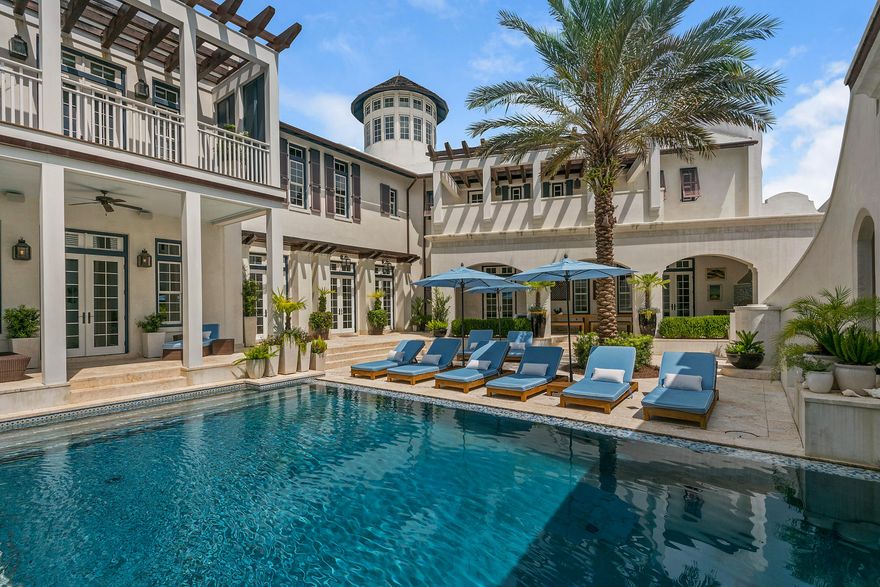Located in the heart of Alys Beach, you will find a 6,880 square foot compound, built to surround residents in a beautifully and carefully crafted space that will both accommodate reunions of family and friends or a secluded getaway for two. Renown Florida architect Tom Christ of Christ and Associates designed this property to be a true one of a kind masterpiece. Walk through arched doorways into this stunning property that surrounds a private 42 ' saltwater pool with underwater music features, a sheer decent waterfall and a separate roof top spa. Gorgeous natural Coral Stone Tile floors line the interior and exterior living spaces, Calcutta Gold Marble stretches across kitchen and bathroom counter-tops, high beamed ceilings and white Venetian Plaster walls contribute to the light,