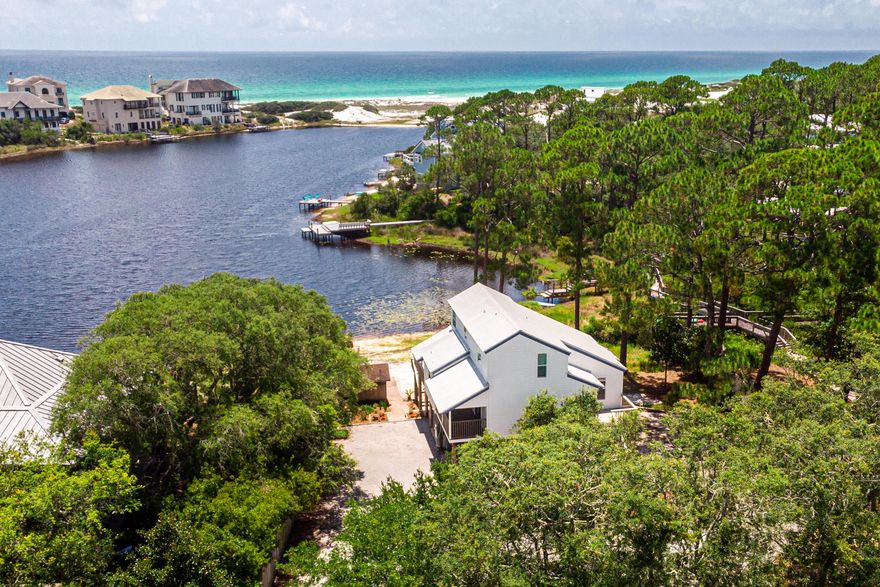South of 30A overlooking a coastal dune lake is this incredible, newly renovated home, offering sweeping views of Stallworth Lake and the Gulf of Mexico. The picturesque views can be found from nearly every portion of the home, from the expansive back porch, the kitchen, family room and the 3 bedrooms. Along with the beautiful views the home has recently undergone a total restoration making it turn key with all new kitchen, floors, bathrooms, lighting, appliances and new high end coastal decor furnishings. There is no need to stress about finding beach parking as the local beach access is a short .4 mile distance by foot or .3 by paddle. The beach access for this area is low density and neighboring Topsail State park is a just a short walk down from the access making