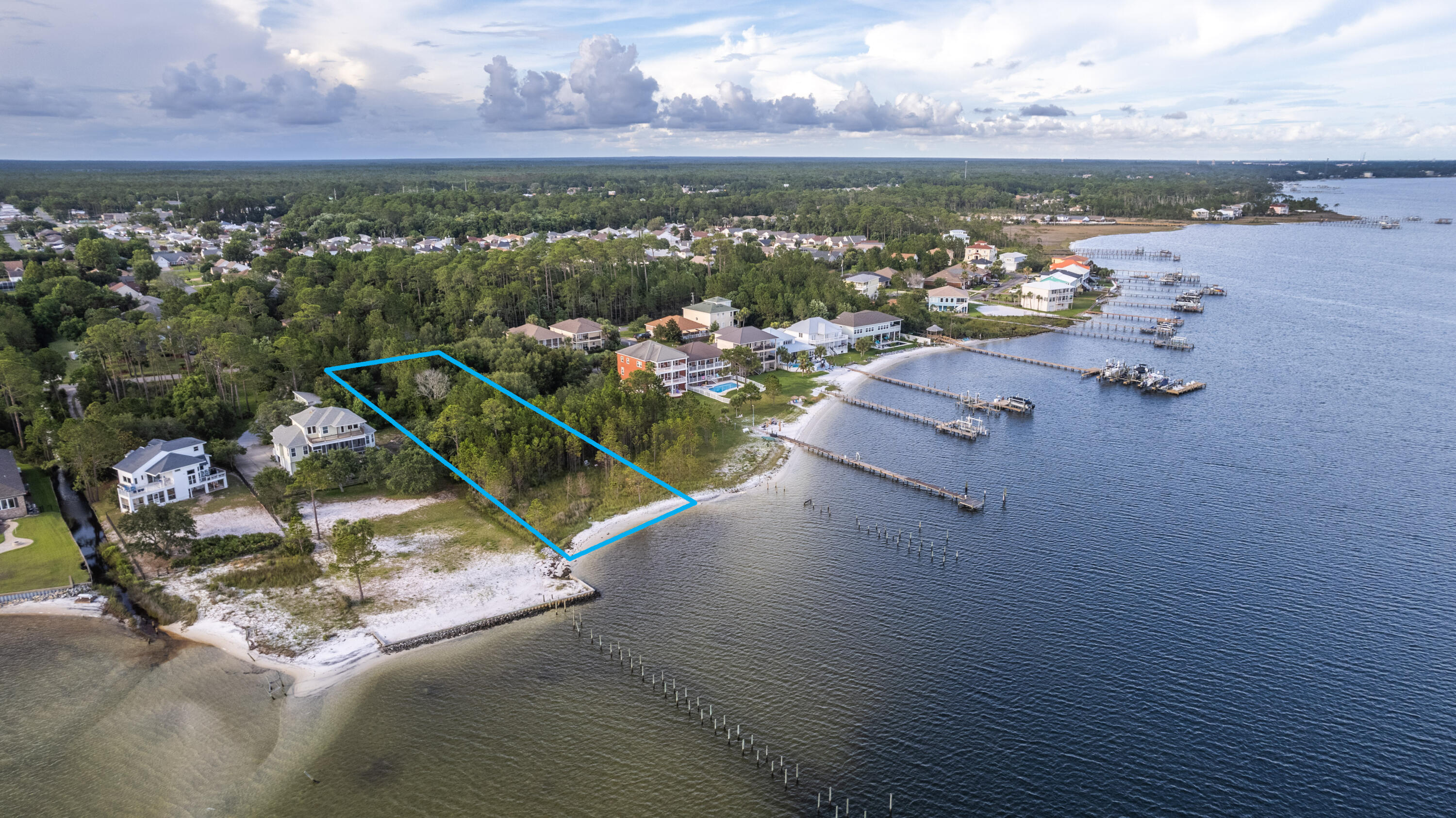Come build your DREAM HOME on this wonderful 1.39 acre waterfront lot with 100 feet of waterfront footage! Rare waterfront lot with it's own private sandy beach with protected views across the sound. Enjoy countless sunsets while watching the abundant local wildlife. No HOA and plenty of room for all your toys. Come enjoy all Florida has to offer. Located 10 miles to Okaloosa Island, 9 miles to Navarre Beach and 5 miles to Hurlburt Field.