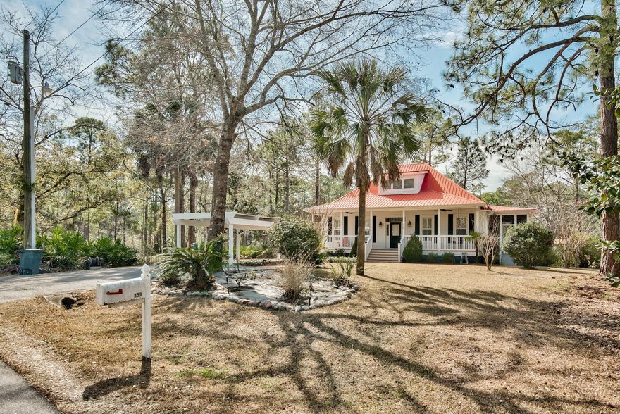 Short sale. Owned by an interior designer & designed after a Coastal Living's Dream Home, this Home has a natural flow & charm that comes from a professional's expertise. Located on Mallet Bayou, step out the back door & take a ride in your boat. Fish from your dock. Relax on the expansive wrap-around porch & enjoy the waterfront Florida lifestyle you've always dreamed of! This Home's enclosed screen porches extend the natural living space & offer beautiful water views. Custom built, this Home offers true ''Open Concept Living''. The spacious Kitchen with granite counters, large double sink & separate prep sink, ice maker, custom cabinets with slide-out storage & huge 8'9'' x 5' eat-in Island is the heart of the home & is open to the large main Living & Dining spaces. (More)..