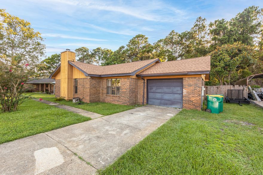 Amazing fix & flip or investment opportunity with this 3 Bedroom / 2 Bath home in Mary Esther! The home is 1,436 sqft and sits on a large lot with complete privacy fencing in the sought-after CHATEAU PRES DE LA MER neighborhood, which is close to many amenities in the area. The interior of the home has a beautiful big brick fireplace. Nice sized dining area and kitchen. This home does need some work and a little TLC will go along way on this home.  This home is on public water and sewer.  Tons of potential with the lot and the interior of the home! THIS WILL NOT LAST LONG - So act quickly!